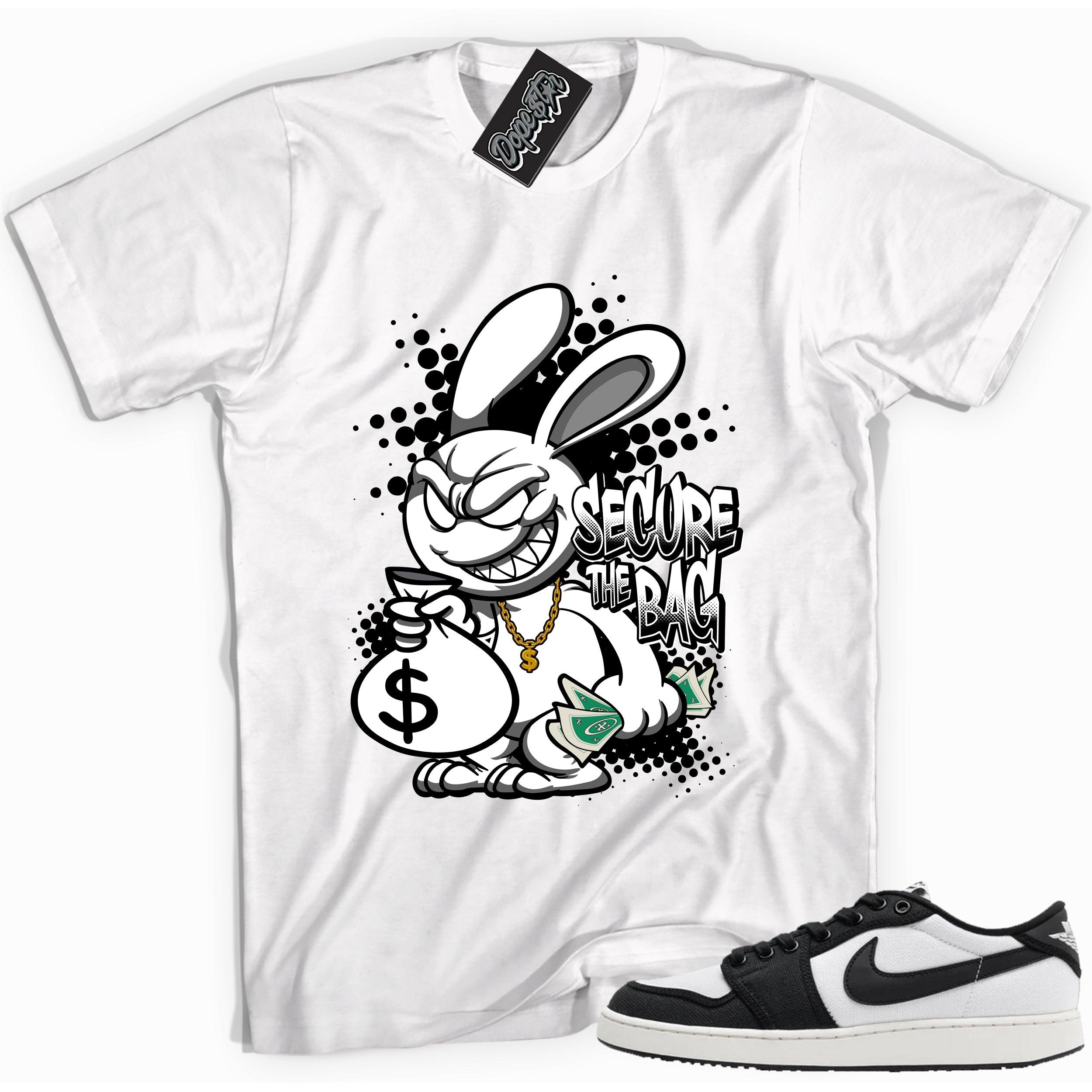 Cool white graphic tee with 'secure the bag' print, that perfectly matches Air Jordan 1 Retro Ajko Low Black & White sneakers.
