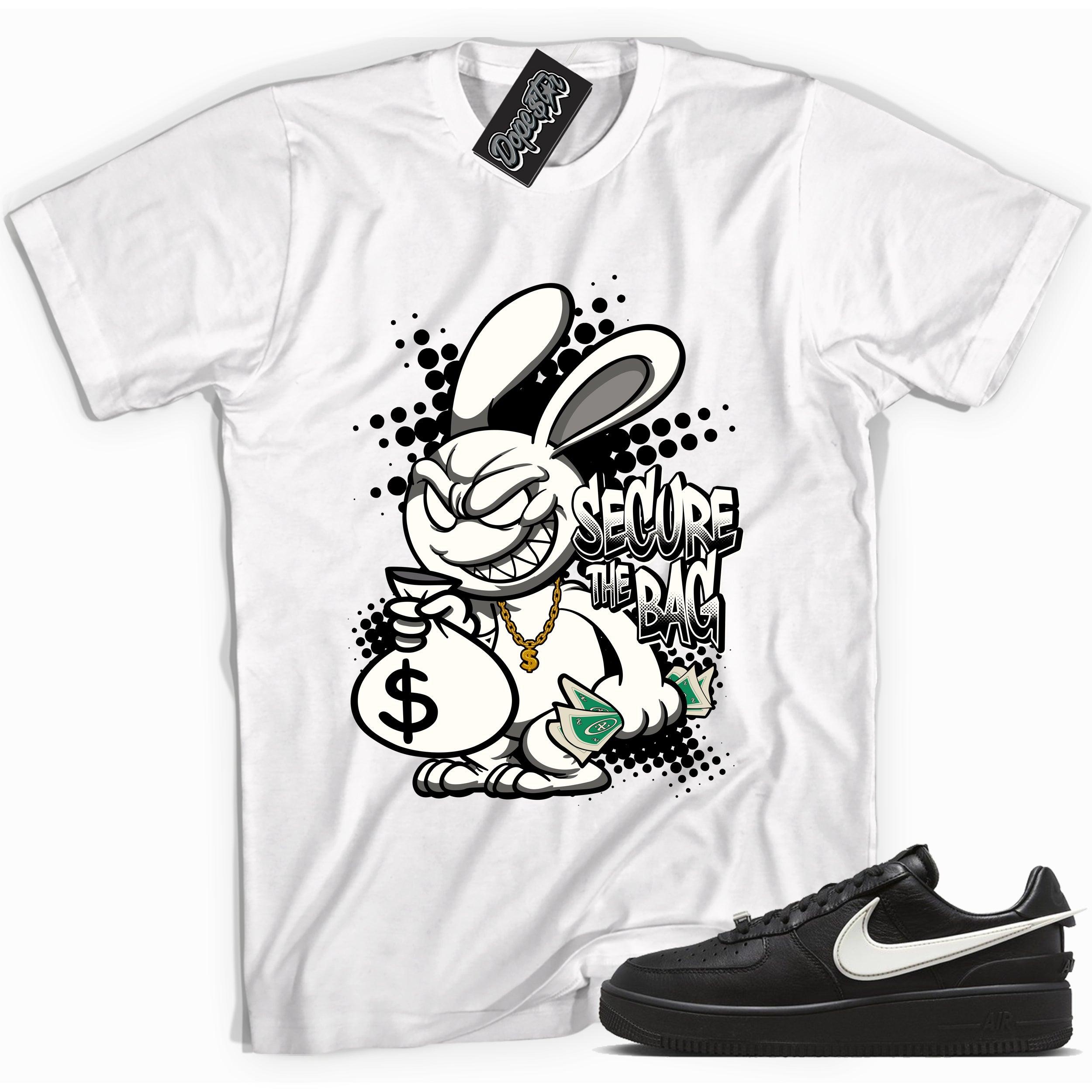 Cool white graphic tee with 'secure the bag' print, that perfectly matches Nike Air Force 1 Low SP Ambush Phantom sneakers.