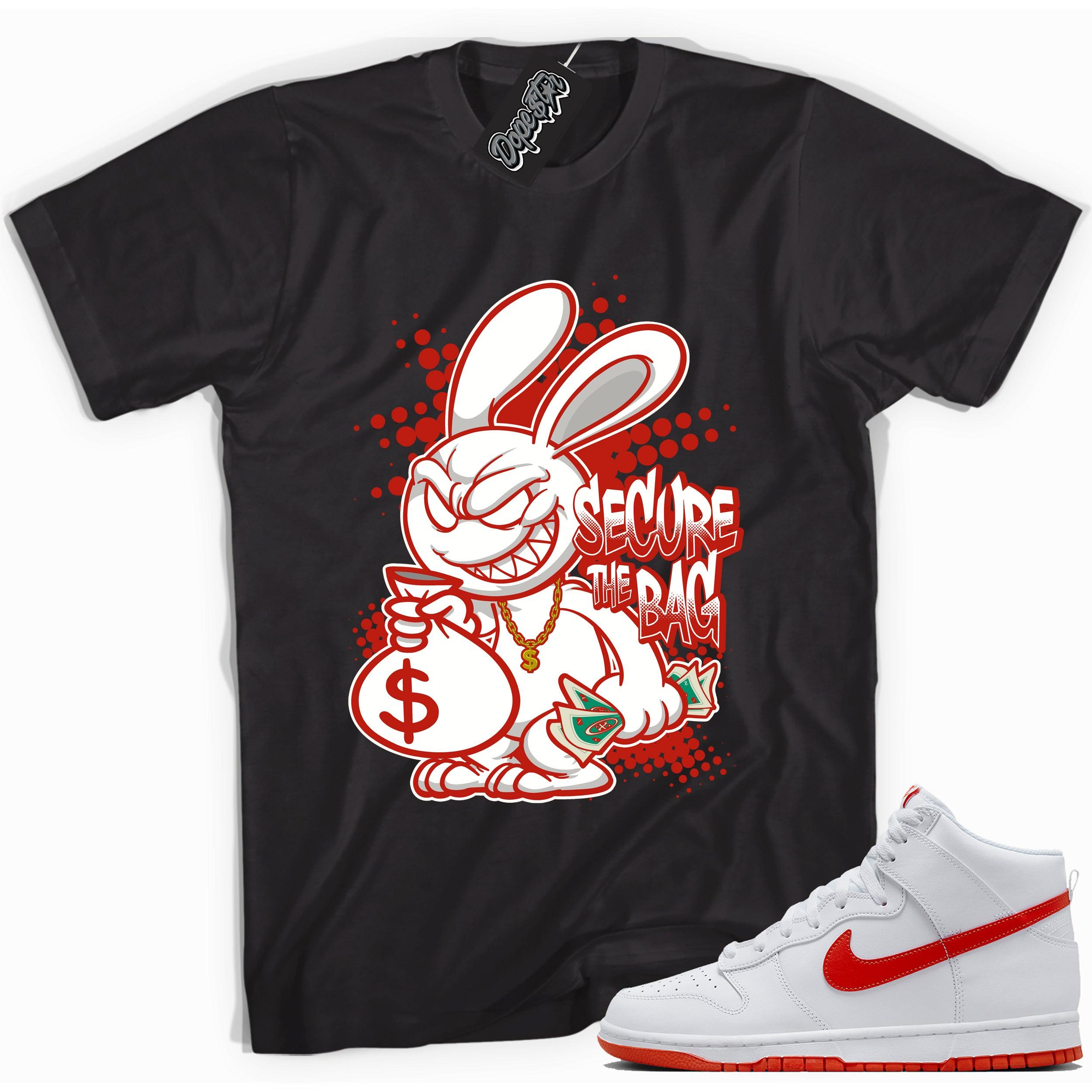 Cool black graphic tee with 'secure the bag' print, that perfectly matches Nike Dunk High White Picante Red sneakers.