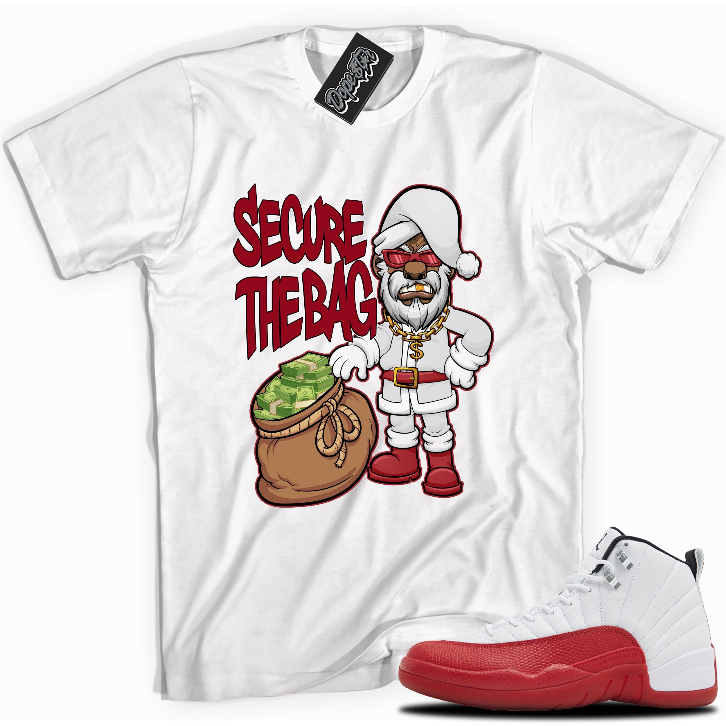 Cool White graphic tee with “Secure The Bag Santa” print, that perfectly matches Air Jordan 12 Retro Cherry Red 2023 red and white sneakers 
