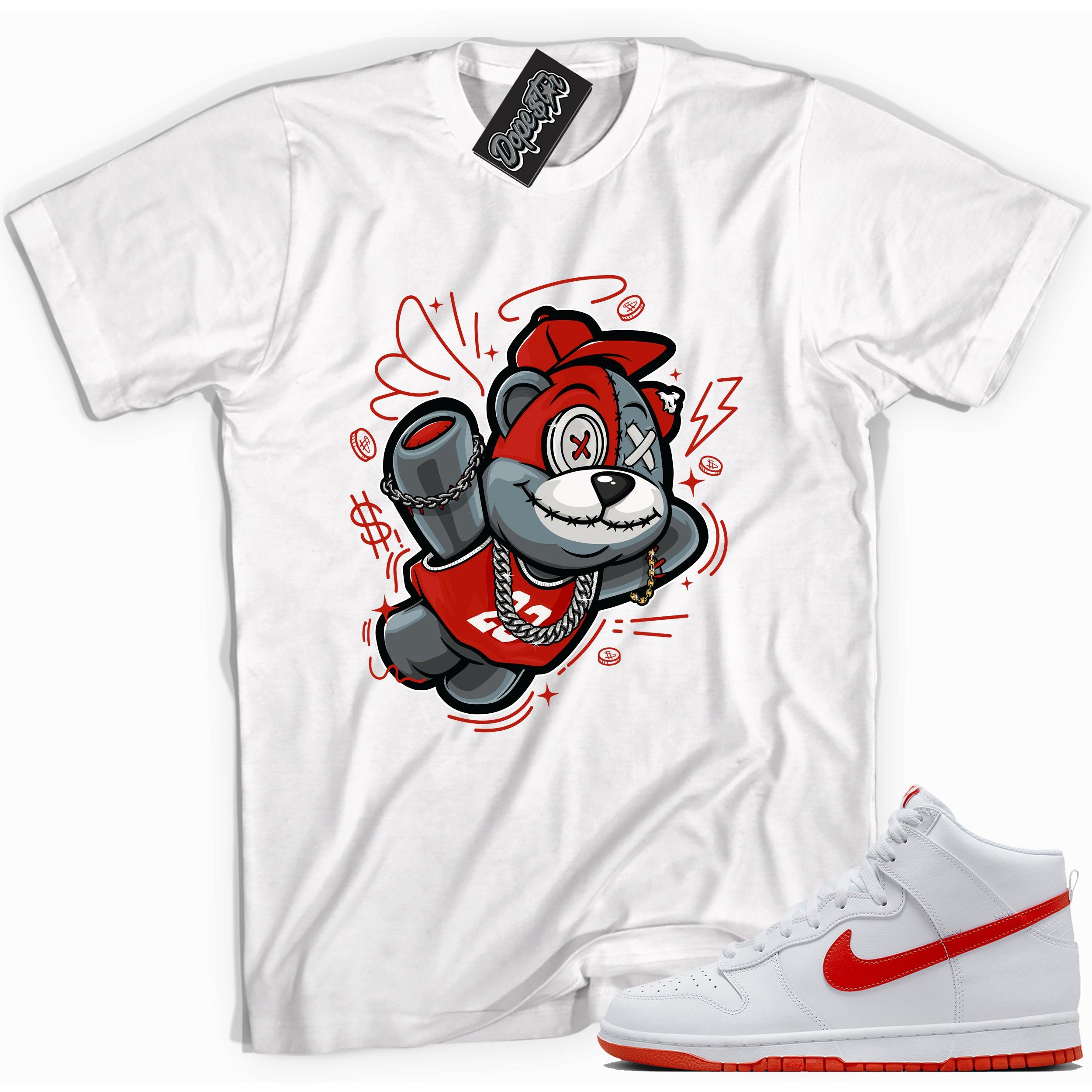 Cool white graphic tee with 'slam dunk bear' print, that perfectly matches Nike Dunk High White Picante Red sneakers.