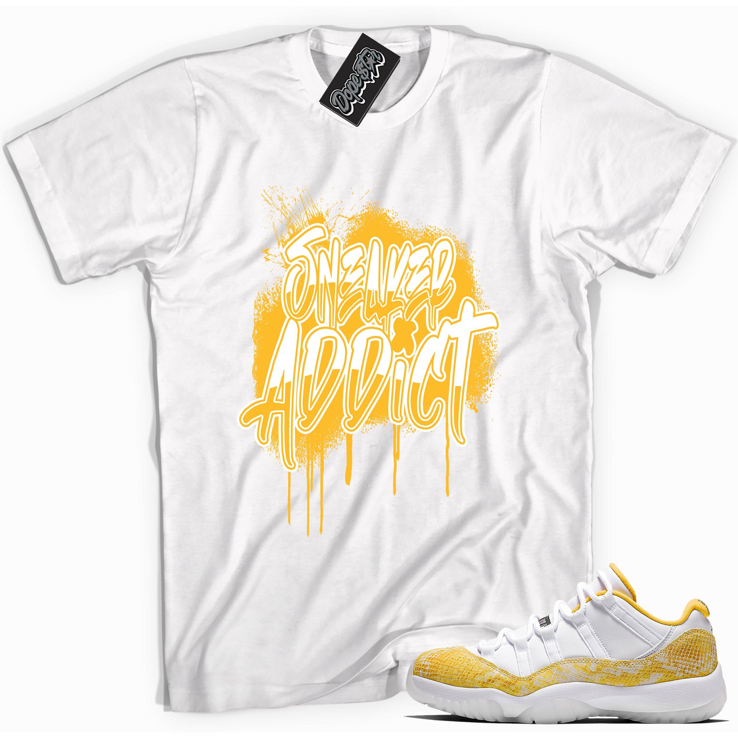 Cool white graphic tee with 'sneaker addict' print, that perfectly matches Air Jordan 11 Retro Low Yellow Snakeskin sneakers