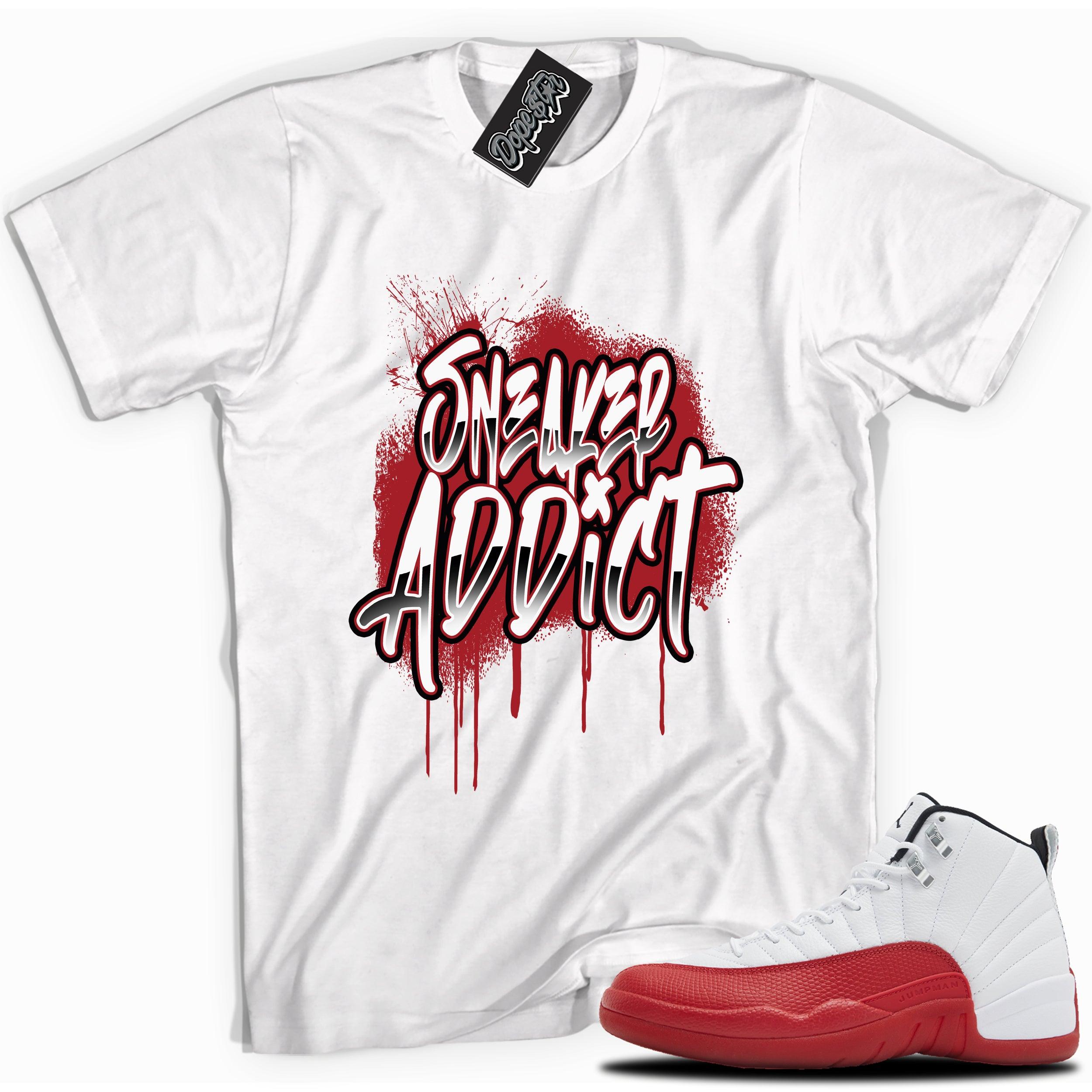Cool White graphic tee with “Sneaker Addict” print, that perfectly matches Air Jordan 12 Retro Cherry Red 2023 red and white sneakers