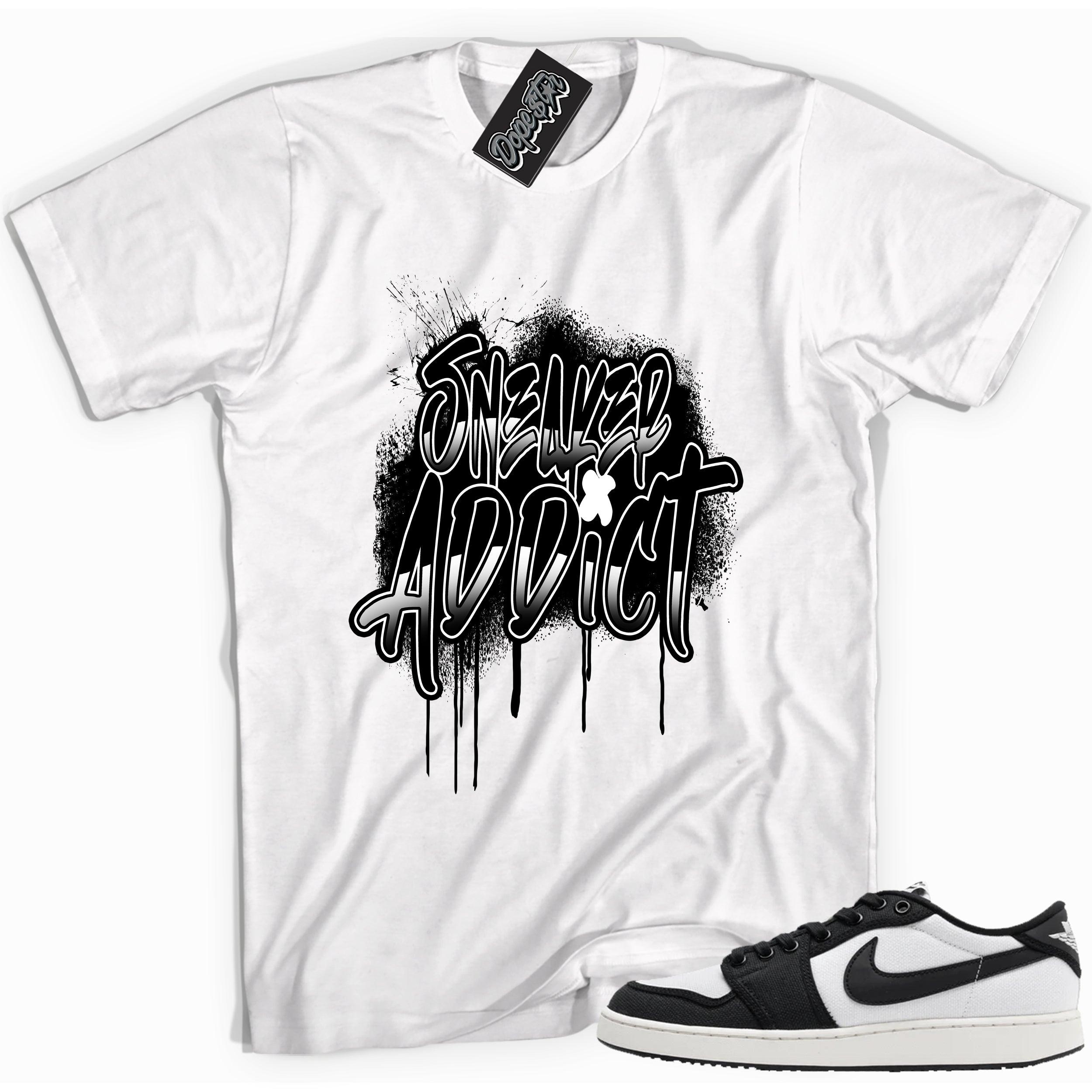 Cool white graphic tee with 'sneaker addict' print, that perfectly matches Air Jordan 1 Retro Ajko Low Black & White sneakers.