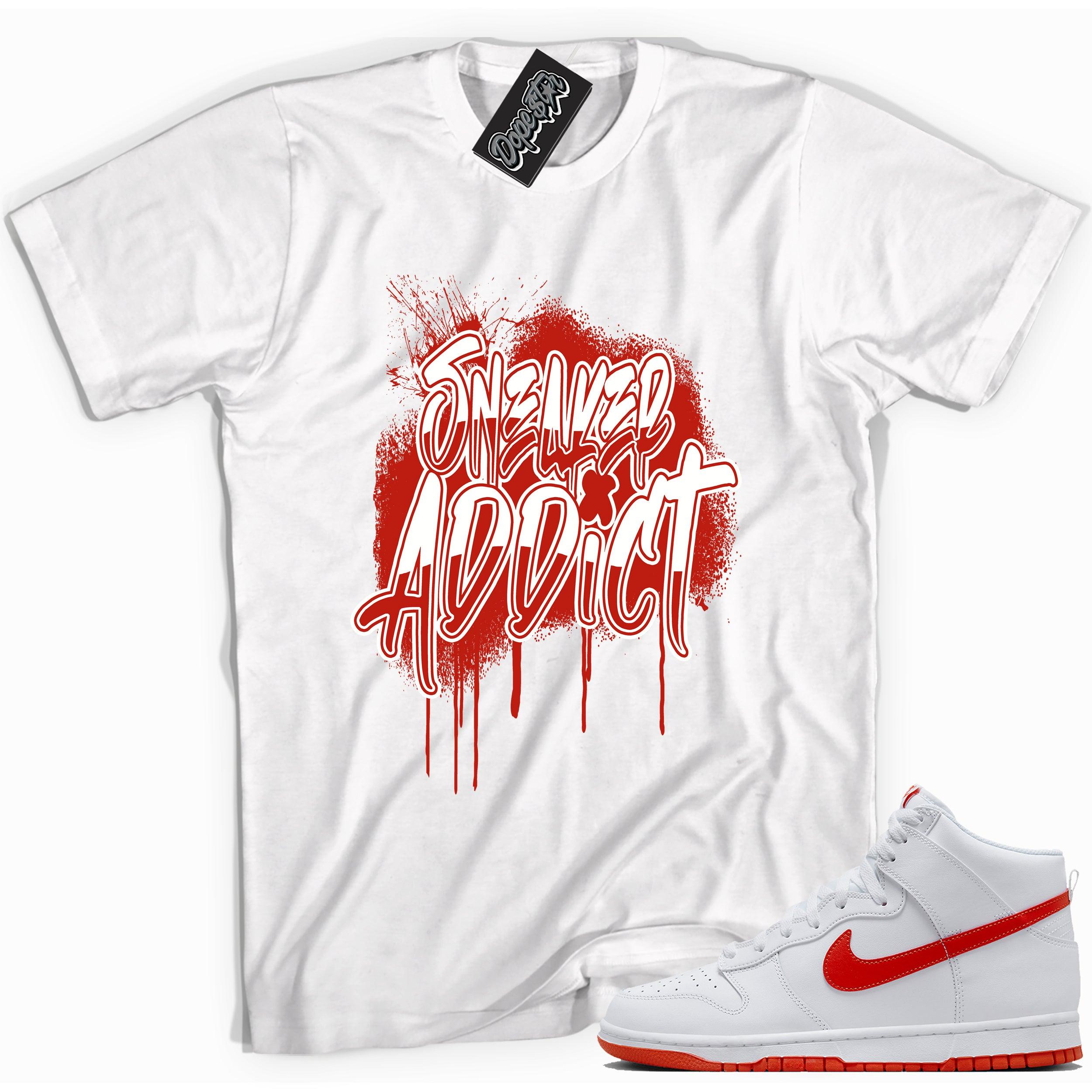 Cool white graphic tee with 'sneaker addict' print, that perfectly matches Nike Dunk High White Picante Red sneakers.