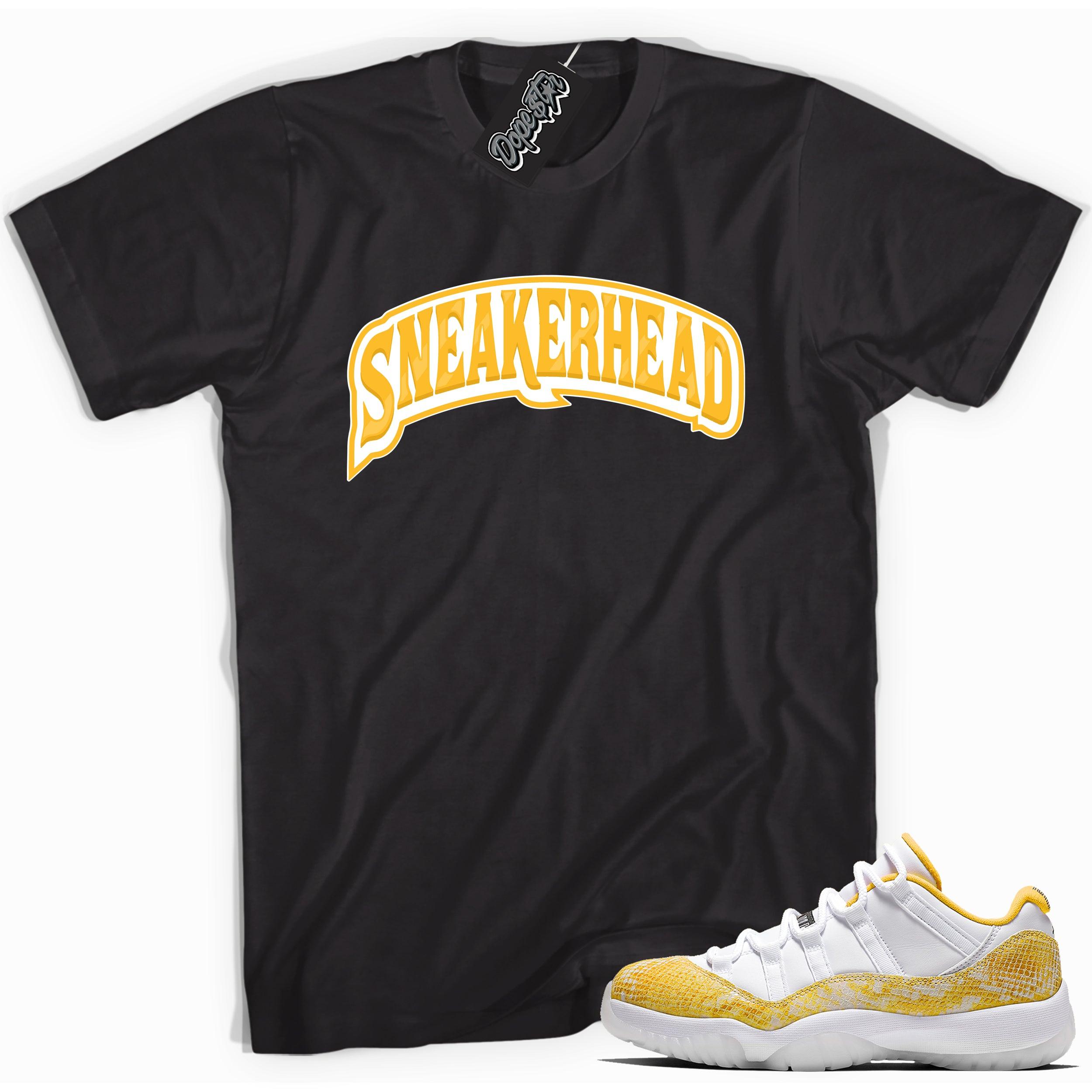 Cool black graphic tee with 'sneaker head' print, that perfectly matches  Air Jordan 11 Retro Low Yellow Snakeskin sneakers