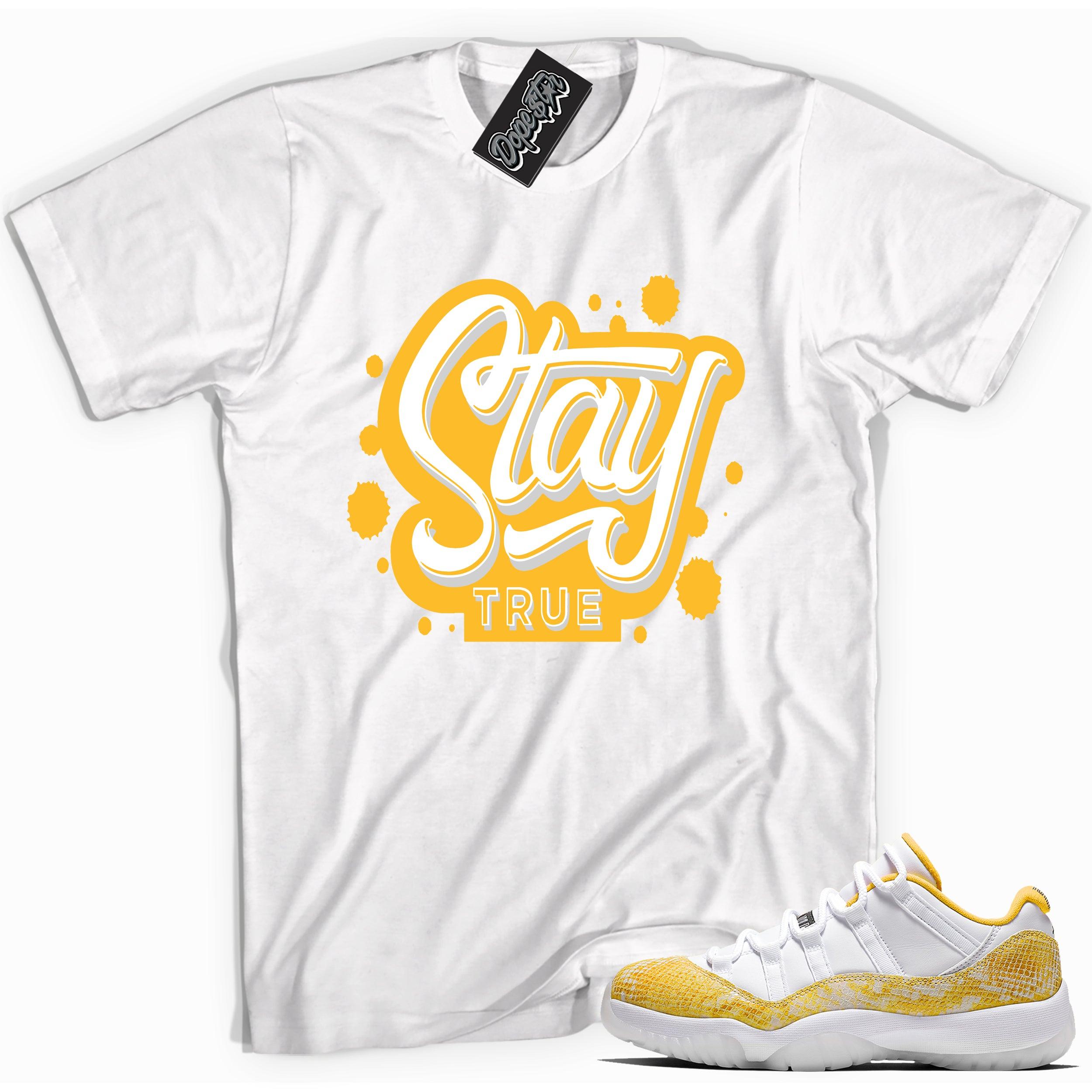 Cool white graphic tee with 'stay true' print, that perfectly matches Air Jordan 11 Retro Low Yellow Snakeskin sneakers