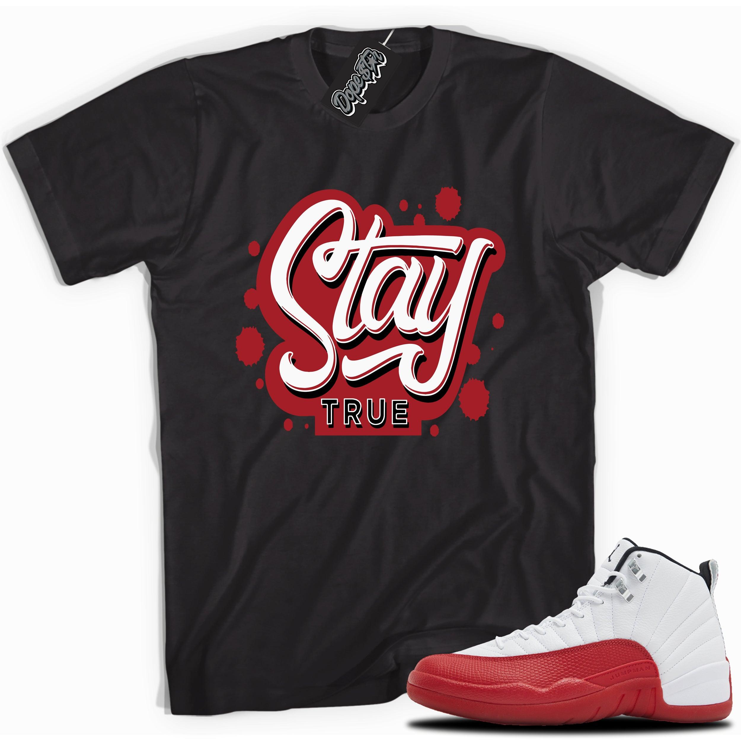Cool Black graphic tee with “Stay True” print, that perfectly matches Air Jordan 12 Retro Cherry Red 2023 red and white sneakers 