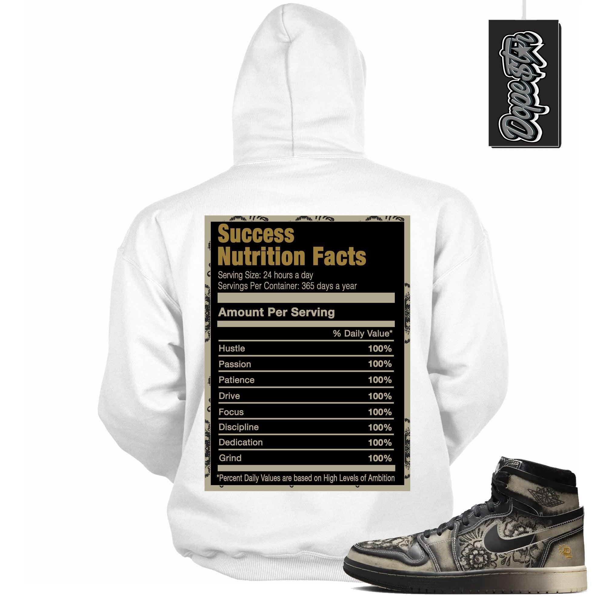 Cool White Graphic Hoodie with “ Success Nutrition “ print, that perfectly matches Air Jordan 1 High Zoom Comfort 2 Dia de Muertos Black and Pale Ivory sneakers