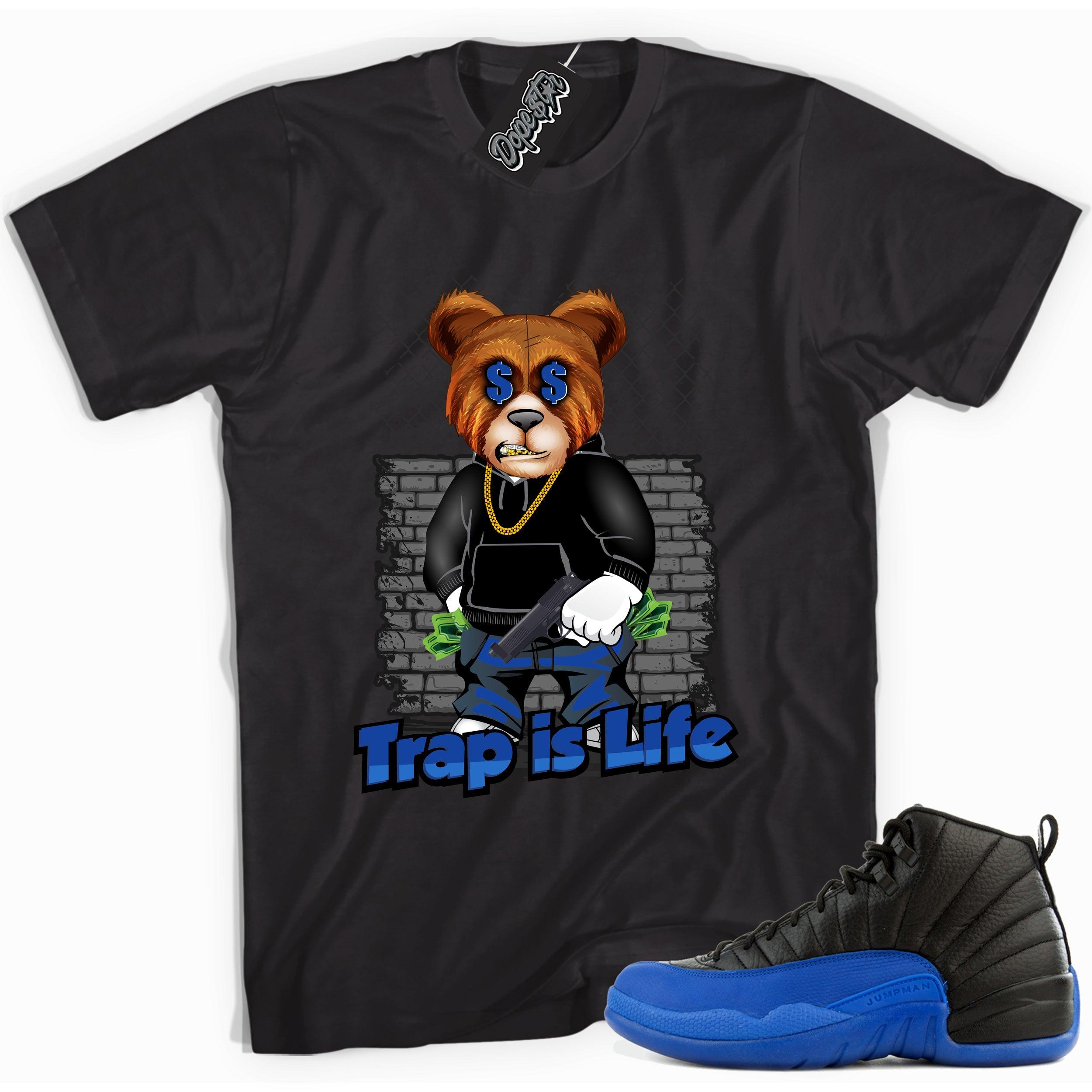 Cool black graphic tee with 'trap is life' print, that perfectly matches  Air Jordan 12 Retro Black Game Royal sneakers.