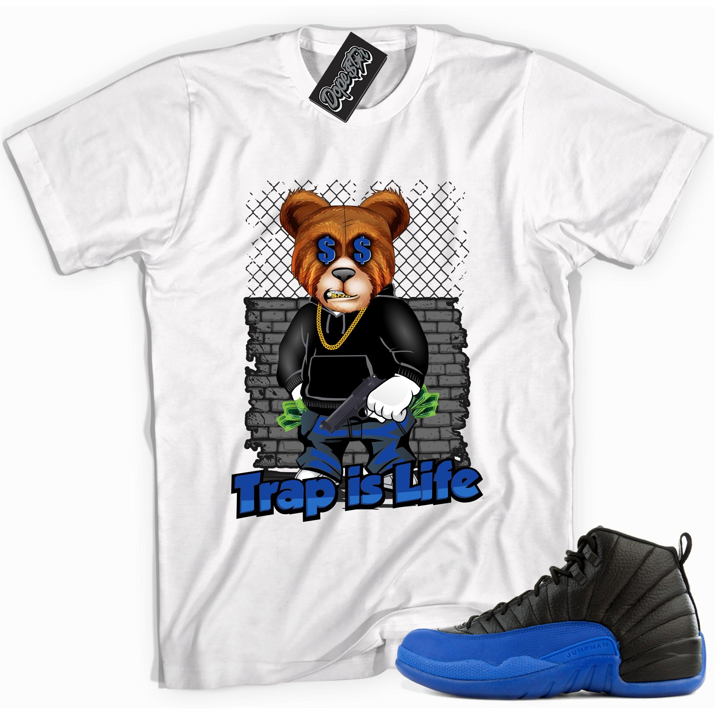 Cool white graphic tee with 'trap is life' print, that perfectly matches Air Jordan 12 Retro Black Game Royal sneakers.