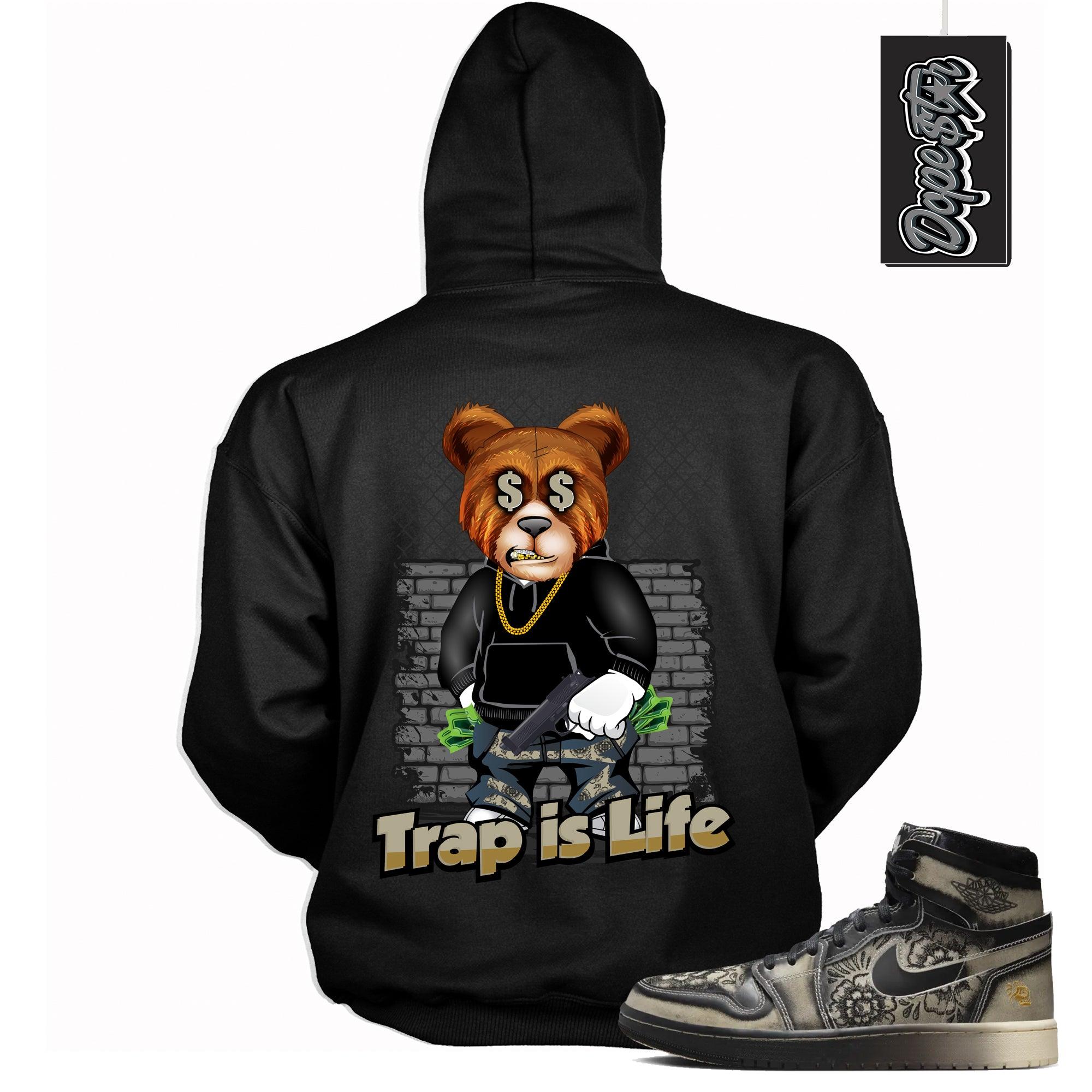Cool Black Graphic Hoodie with “ TRAP IS LIFE “ print, that perfectly matches Air Jordan 1 High Zoom Comfort 2 Dia de Muertos Black and Pale Ivory sneakers