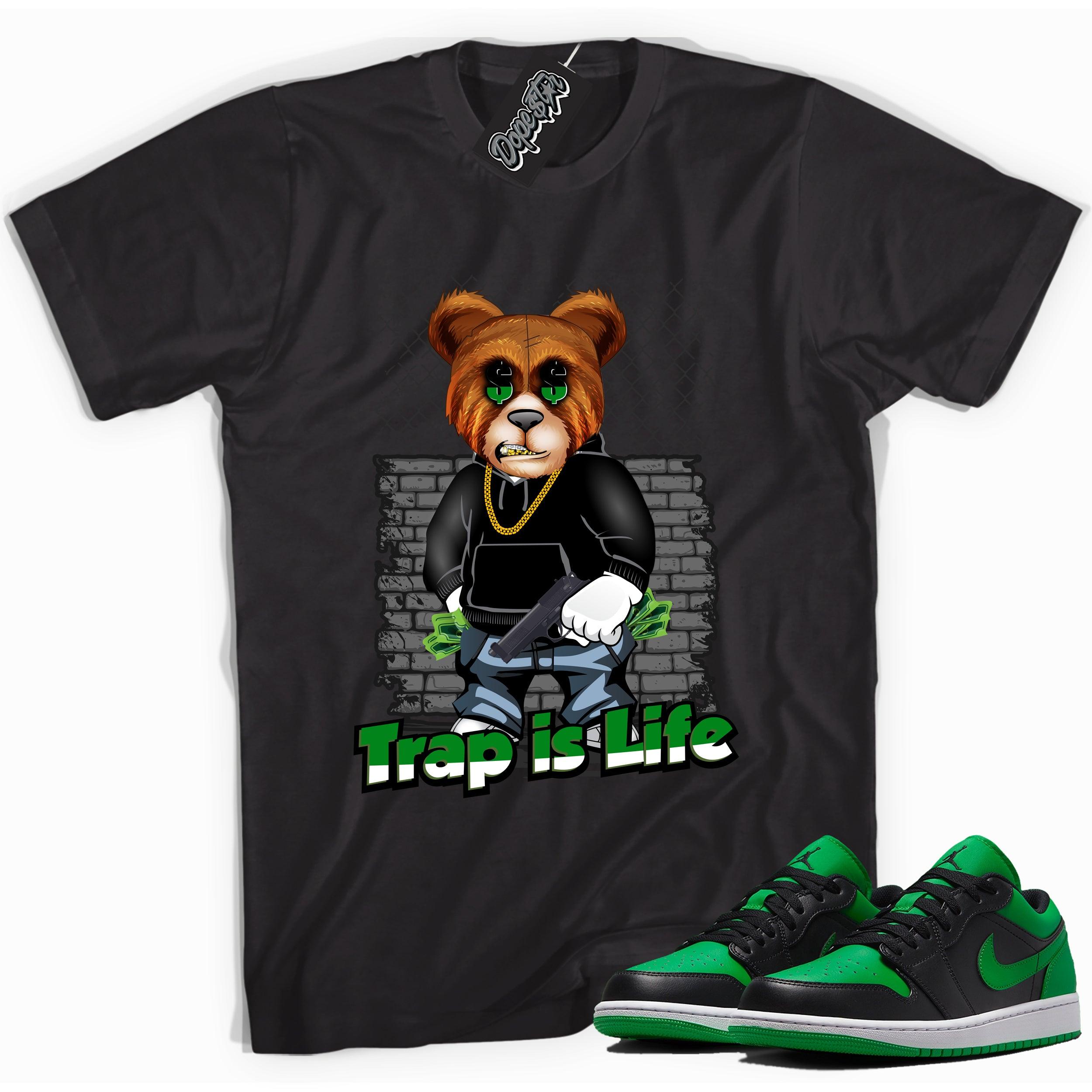 Cool black graphic tee with 'trap is life' print, that perfectly matches Air Jordan 1 Low Lucky Green sneakers