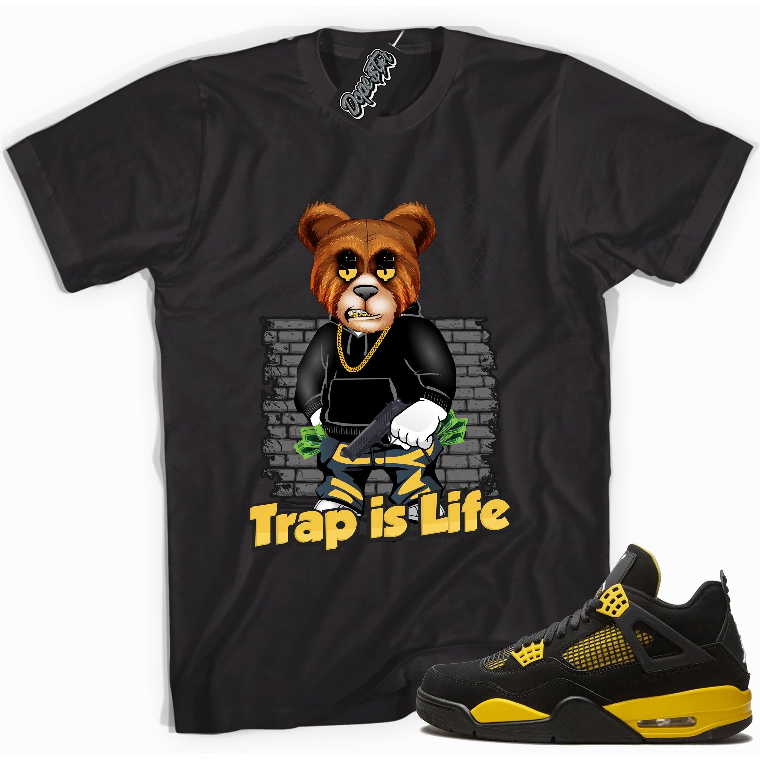Cool black graphic tee with 'trap is life' print, that perfectly matches  Air Jordan 4 Thunder sneakers