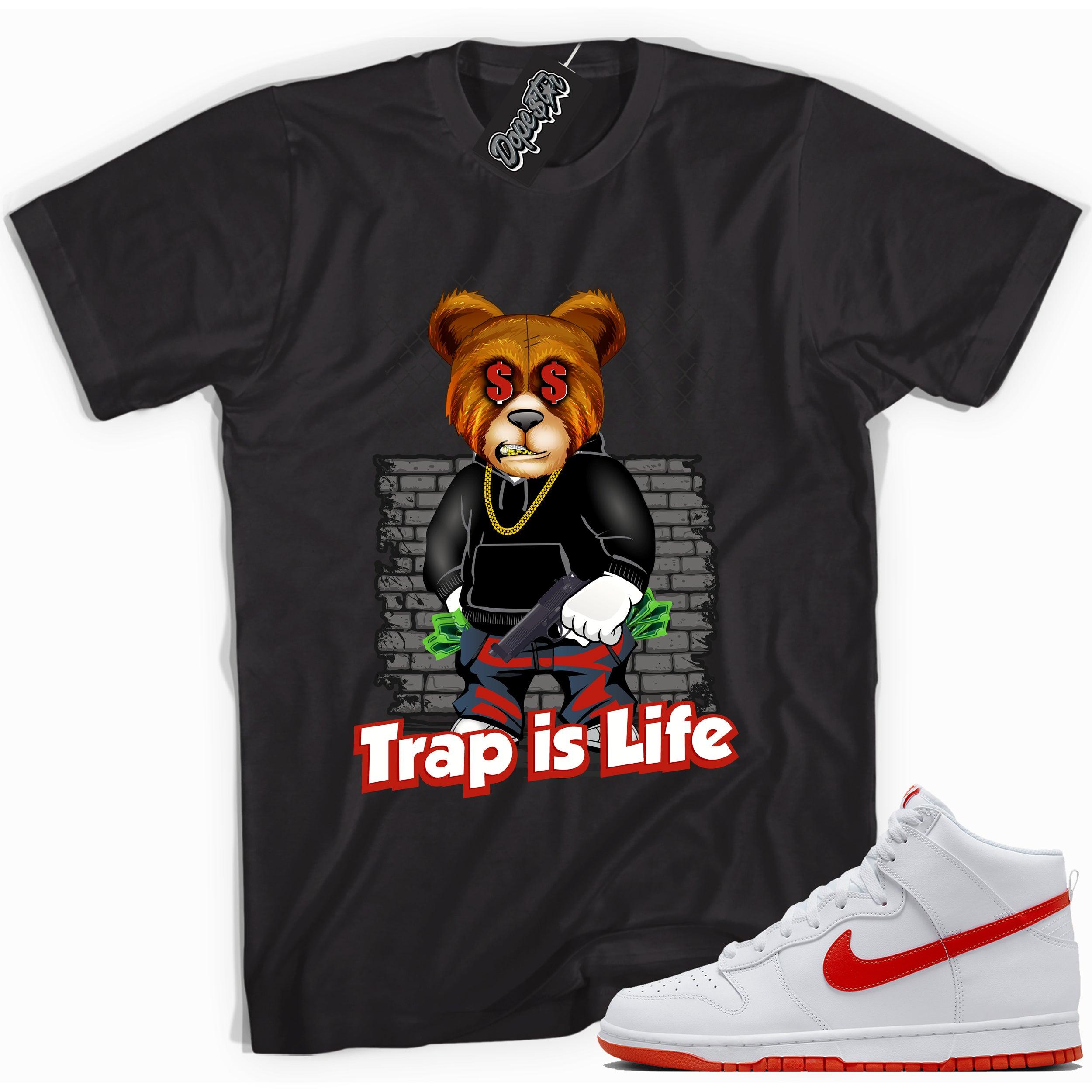 Cool black graphic tee with 'trap is life' print, that perfectly matches Nike Dunk High White Picante Red sneakers.