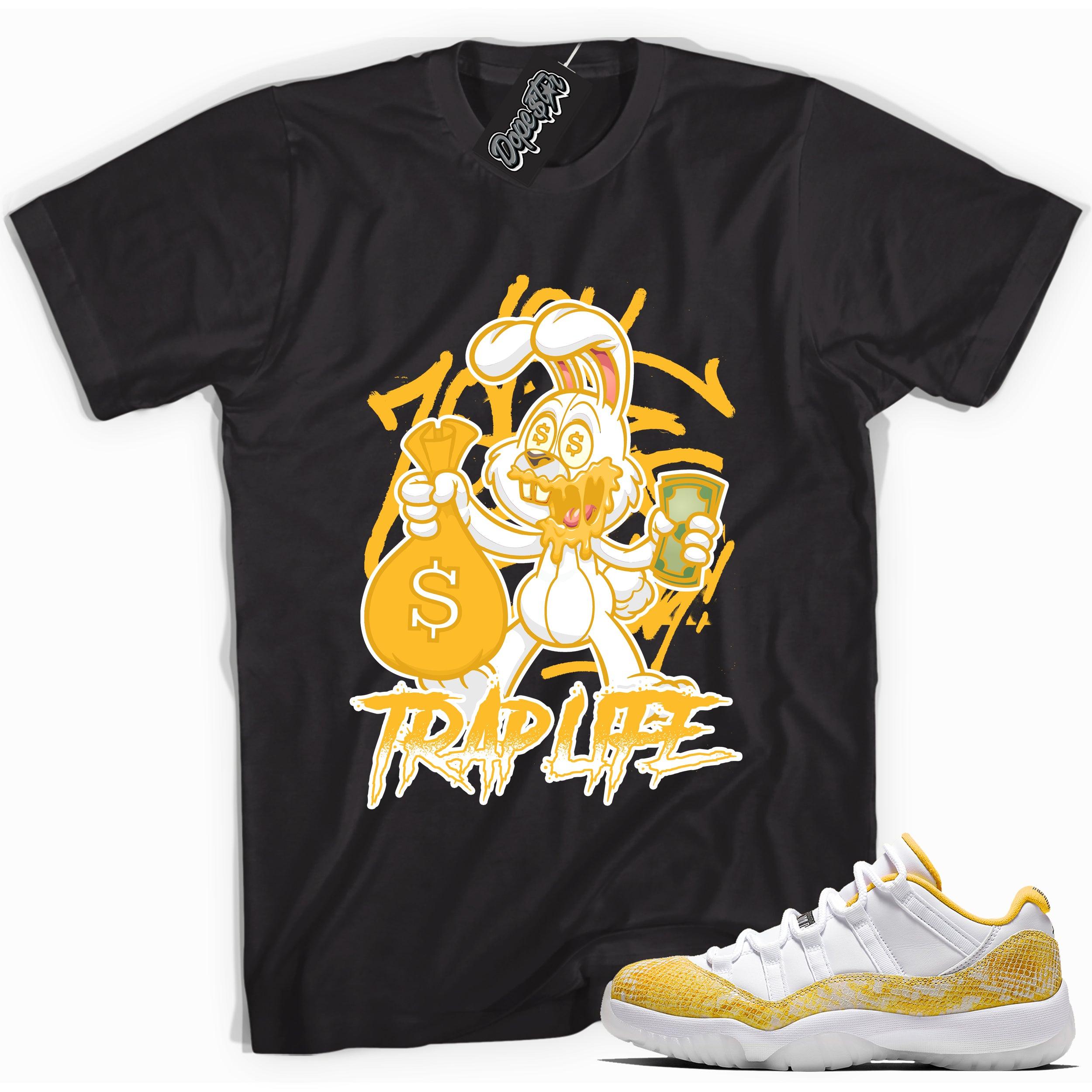 Cool black graphic tee with 'trap life rabbit' print, that perfectly matches  Air Jordan 11 Retro Low Yellow Snakeskin sneakers