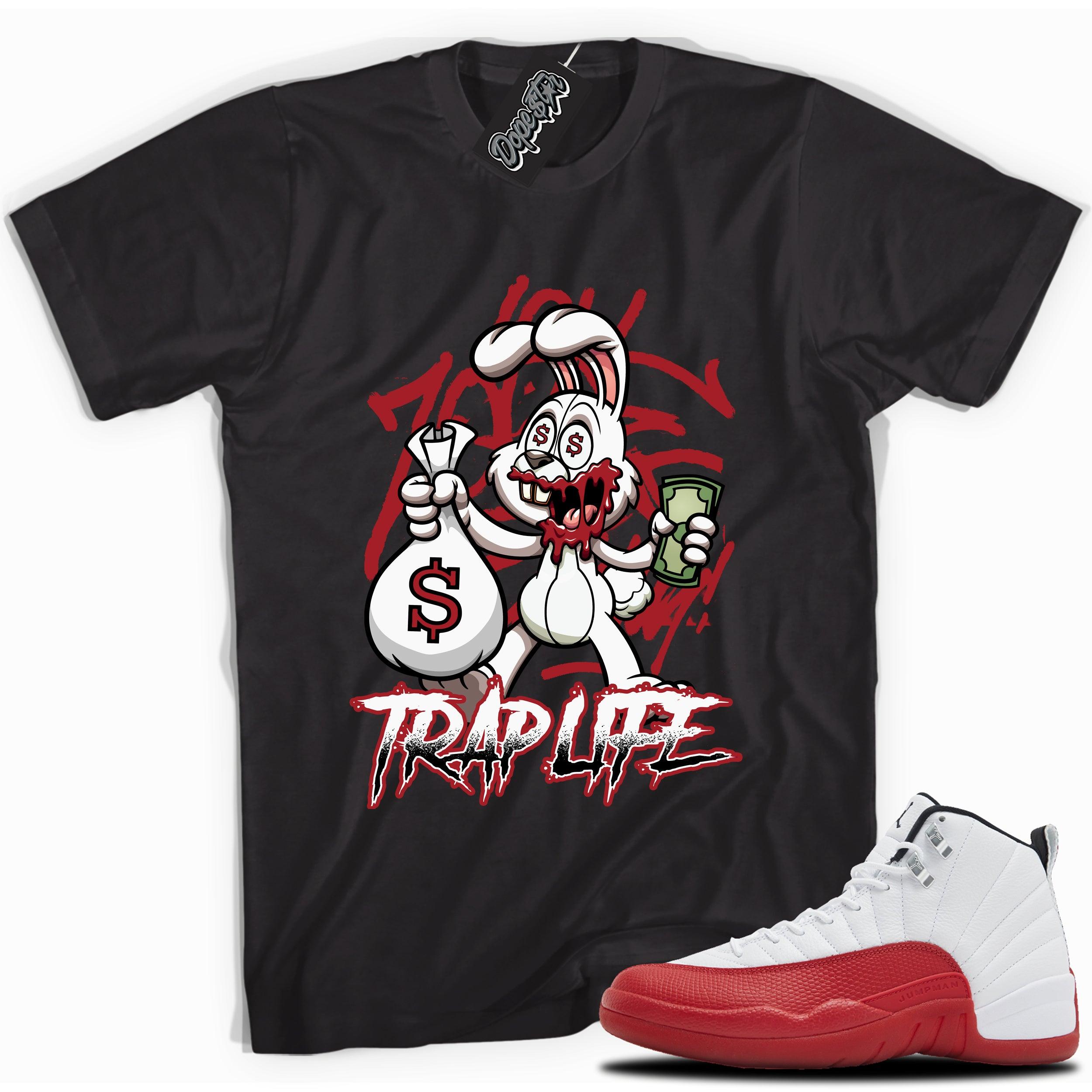 Cool Black graphic tee with “Trap Rabbit” print, that perfectly matches Air Jordan 12 Retro Cherry Red 2023 red and white sneakers 