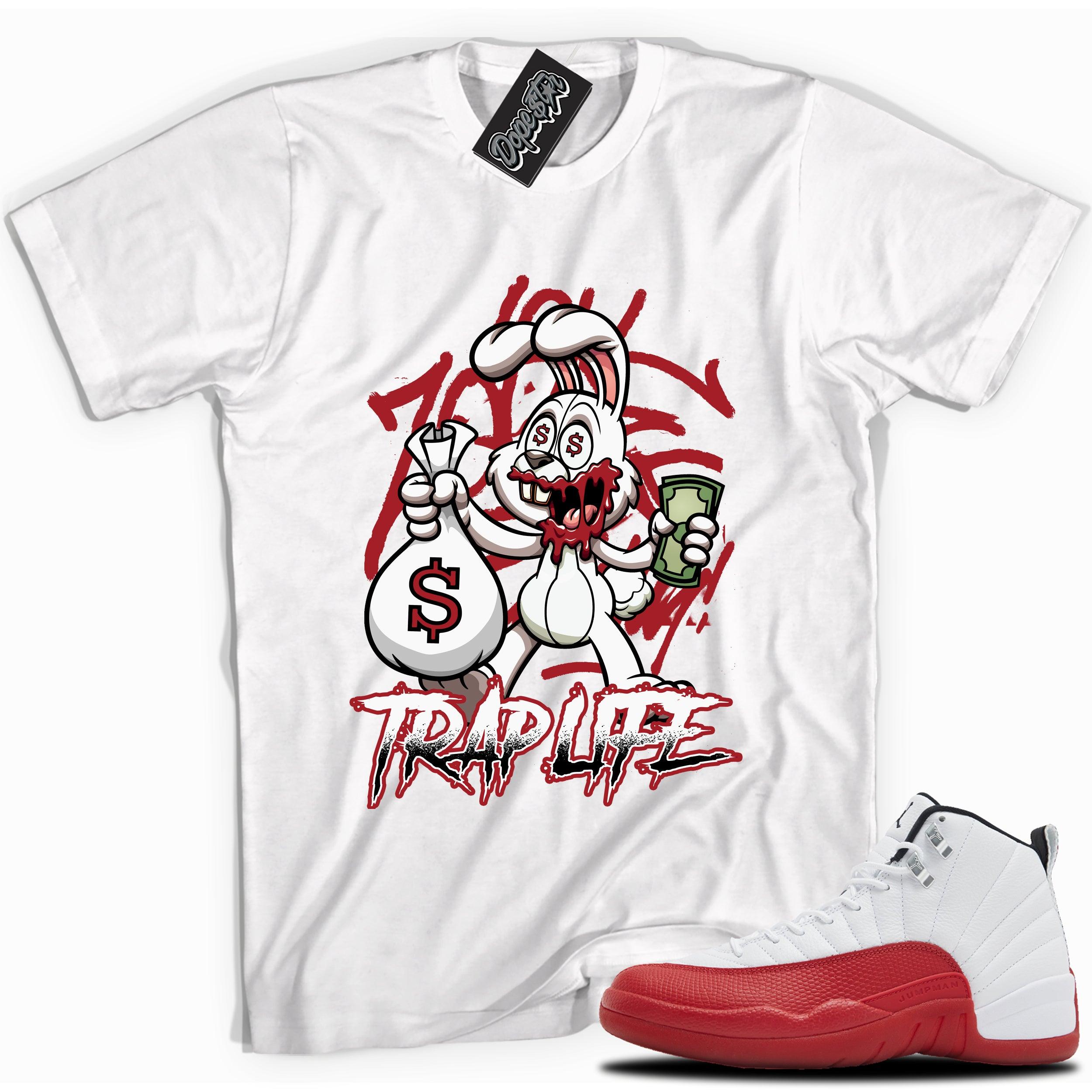 Cool White graphic tee with “Trap Rabbit” print, that perfectly matches Air Jordan 12 Retro Cherry Red 2023 red and white sneakers 