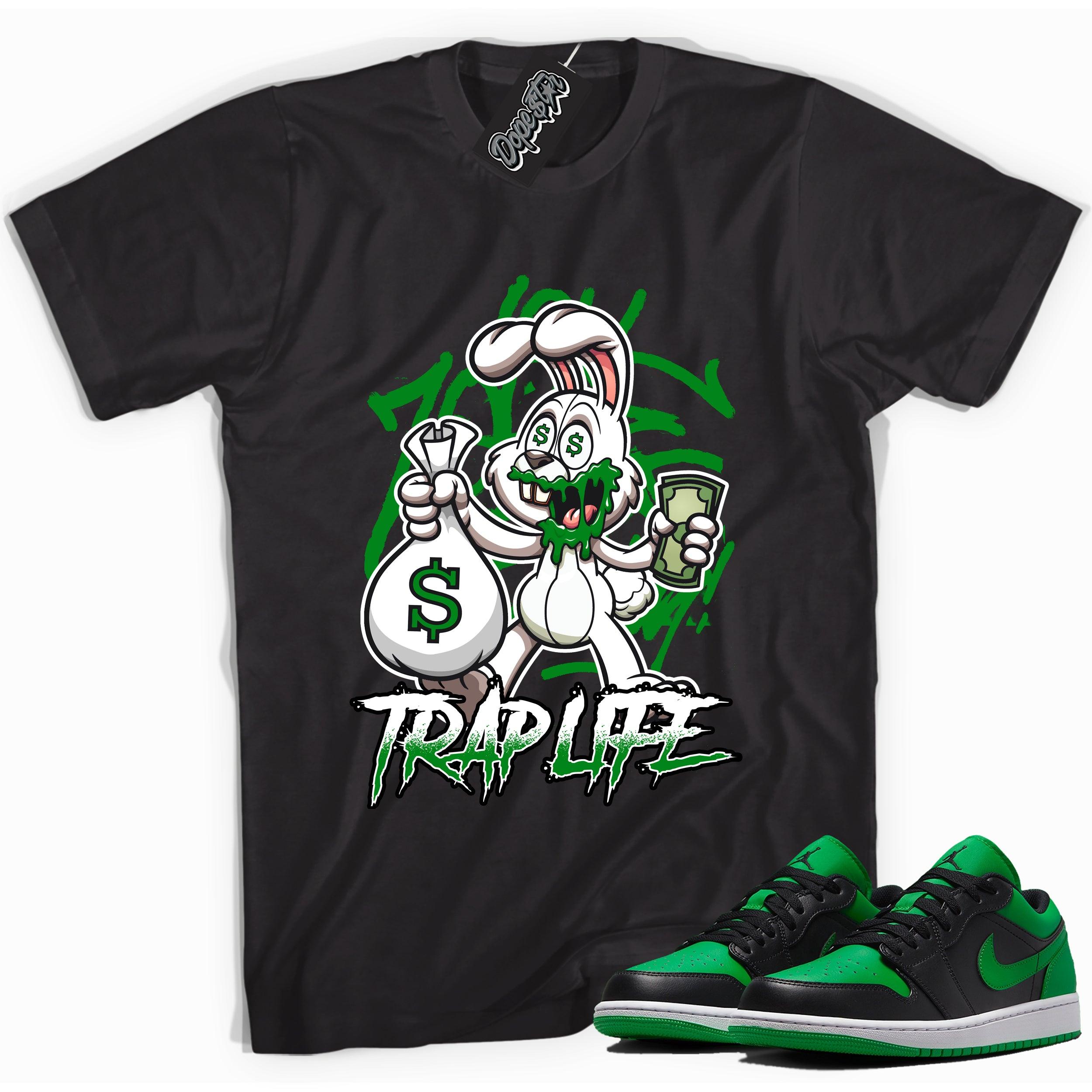 Cool black graphic tee with 'trap life rabbit' print, that perfectly matches Air Jordan 1 Low Lucky Green sneakers