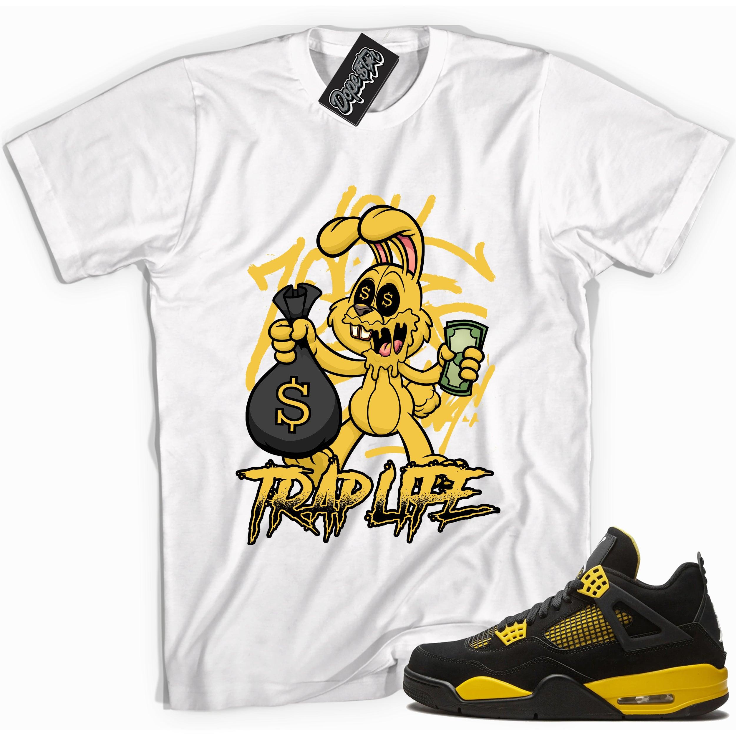 Cool white graphic tee with 'trap rabbit' print, that perfectly matches Air Jordan 4 Thunder sneakers