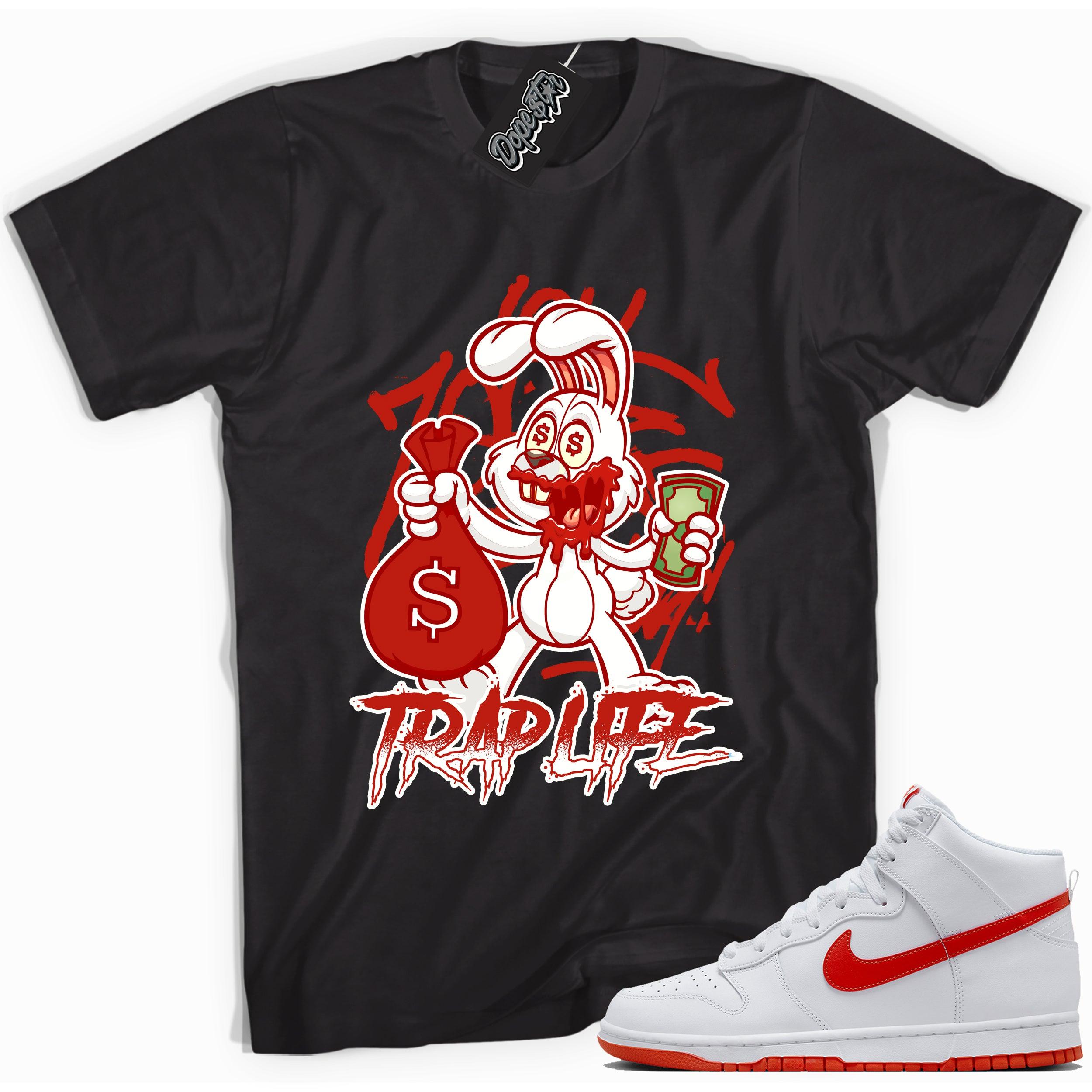 Cool black graphic tee with 'trap rabbit' print, that perfectly matches Nike Dunk High White Picante Red sneakers.