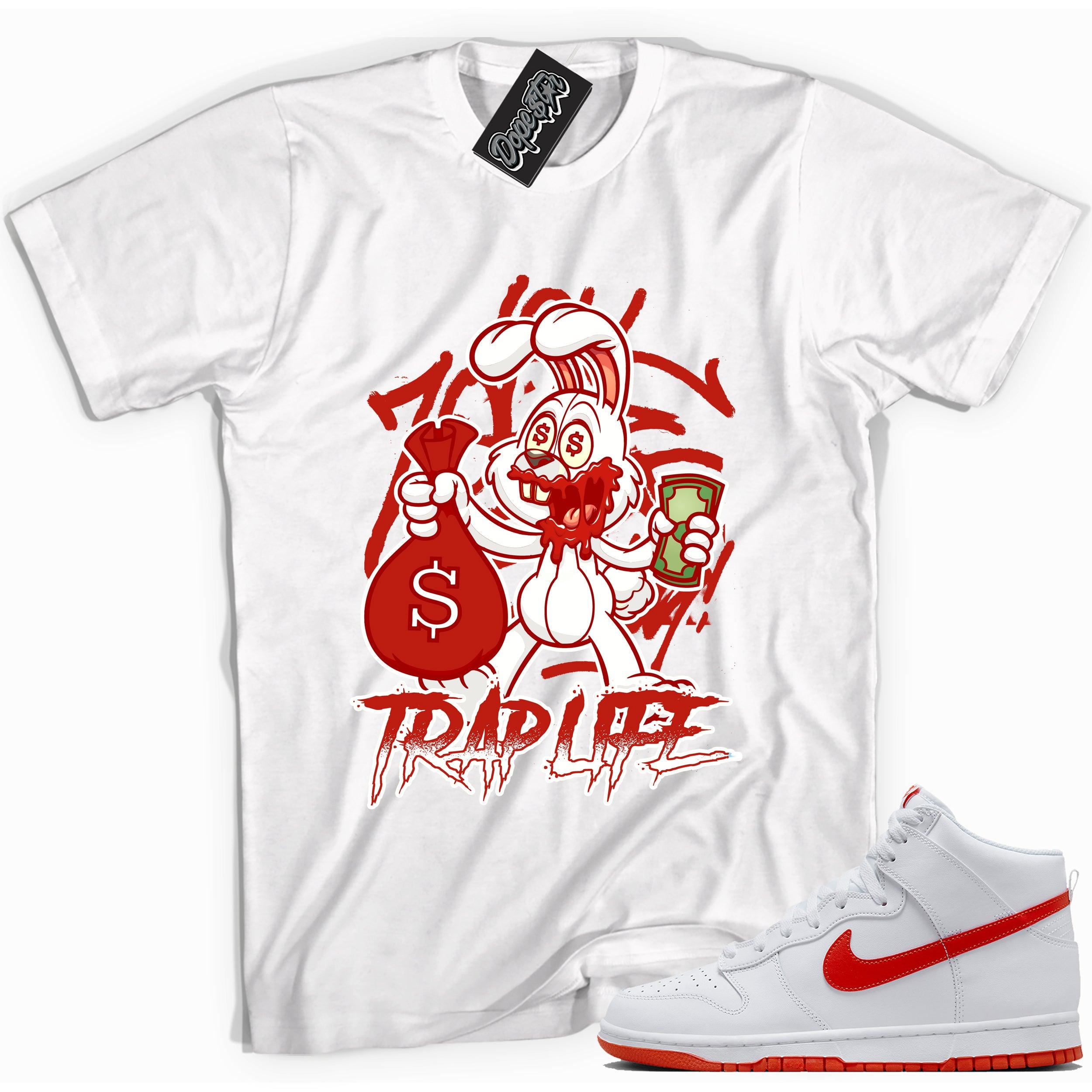 Cool white graphic tee with 'trap rabbit' print, that perfectly matches Nike Dunk High White Picante Red sneakers.