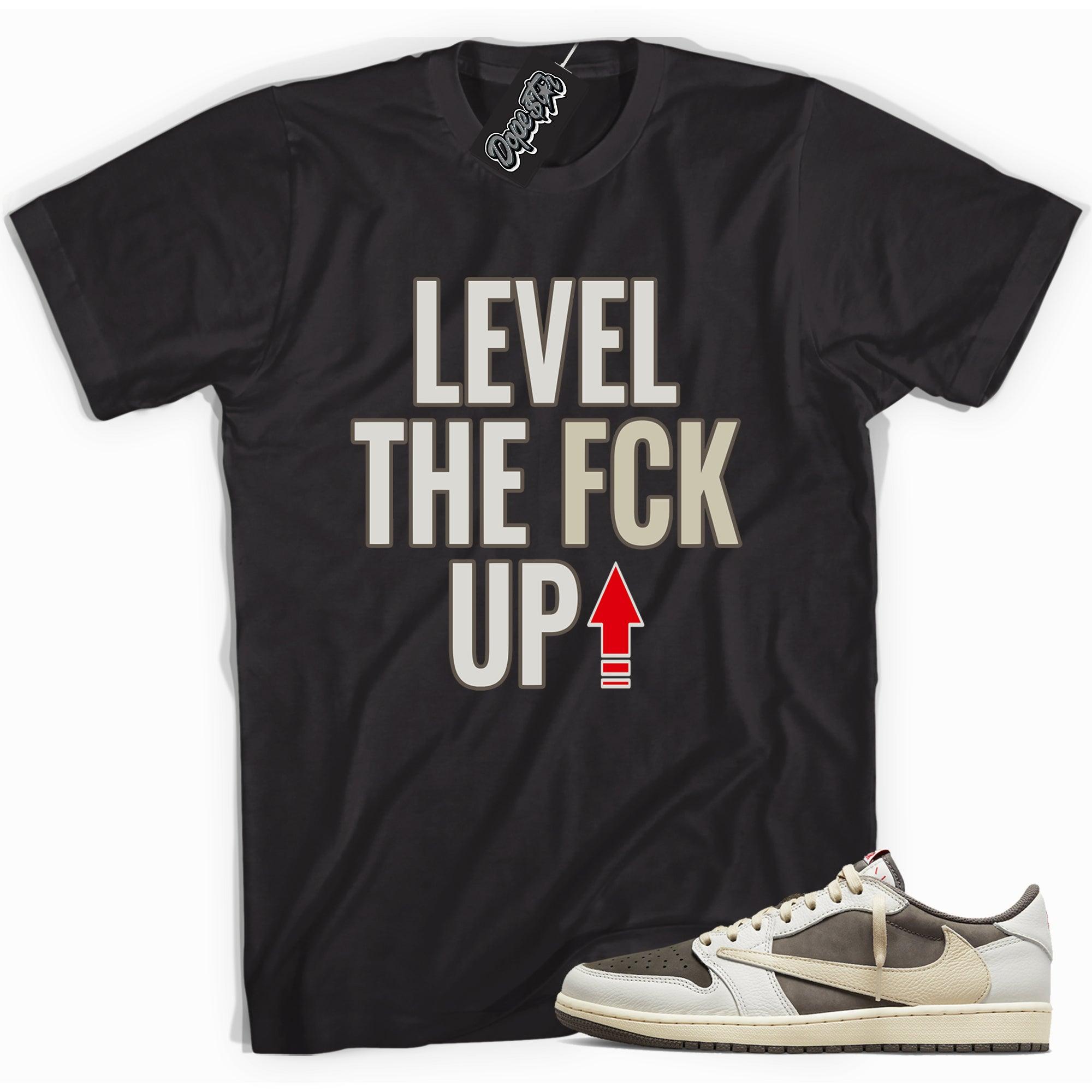 Cool black graphic tee with 'Level Up' print, that perfectly matches Travis Scott's Air Jordan 1 Low 'Reverse Mocha sneakers.