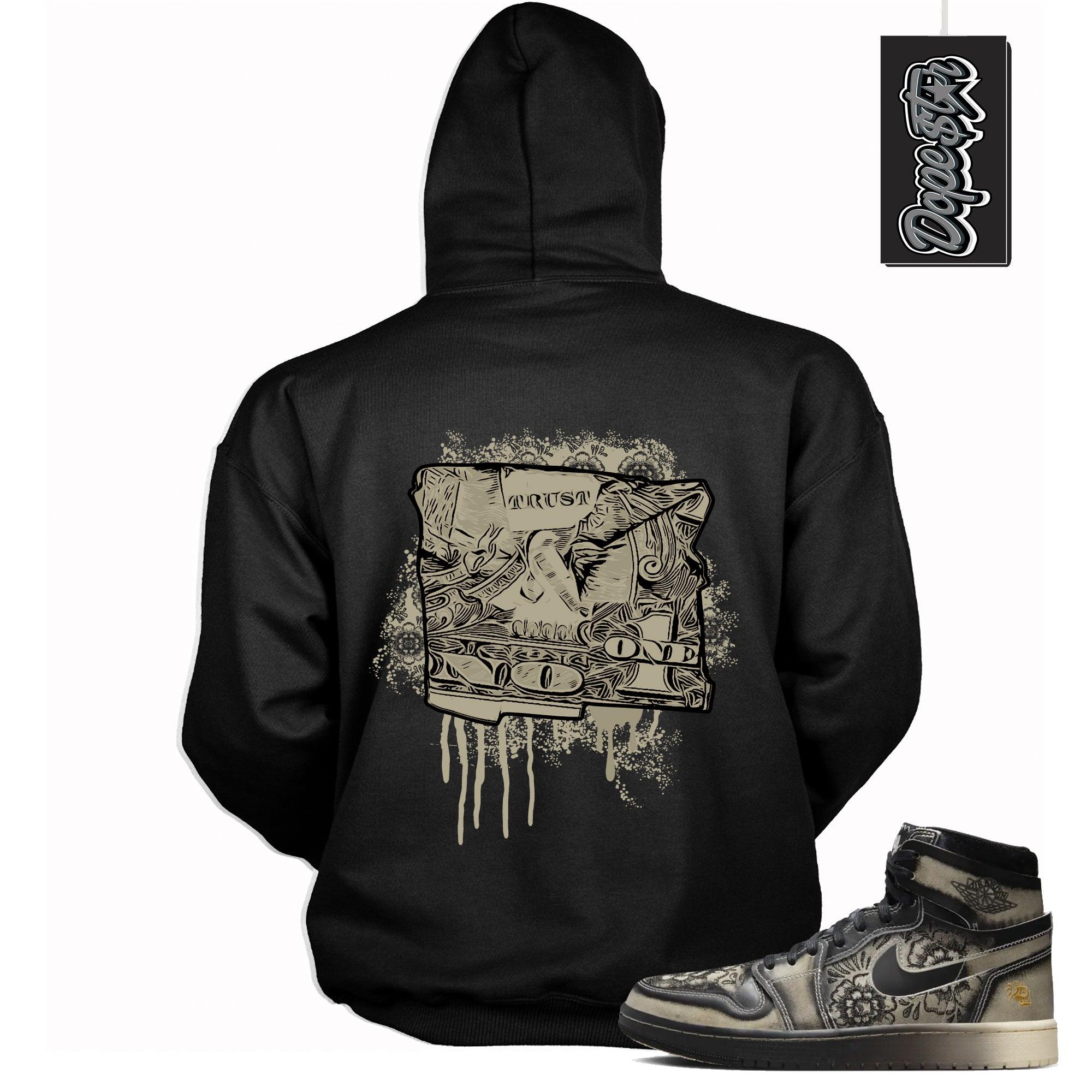 Cool Black Graphic Hoodie with “ Trust No One Dollar “ print, that perfectly matches Air Jordan 1 High Zoom Comfort 2 Dia de Muertos Black and Pale Ivory sneakers