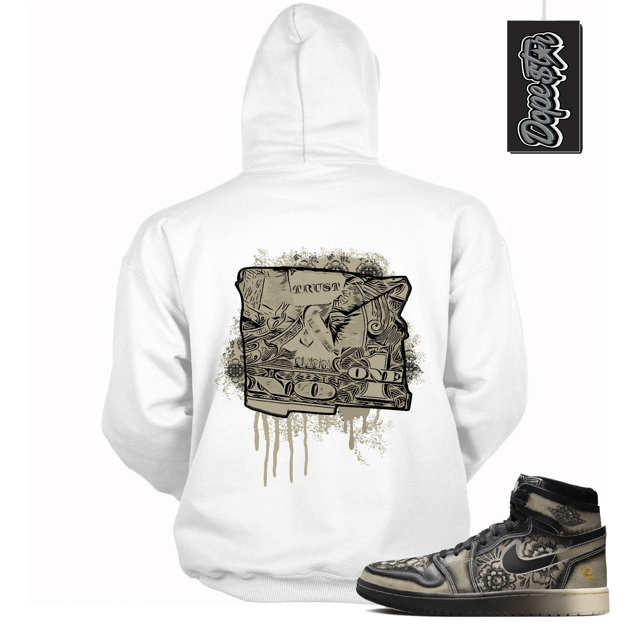 Cool White Graphic Hoodie with “ Trust No One Dollar “ print, that perfectly matches Air Jordan 1 High Zoom Comfort 2 Dia de Muertos Black and Pale Ivory sneakers