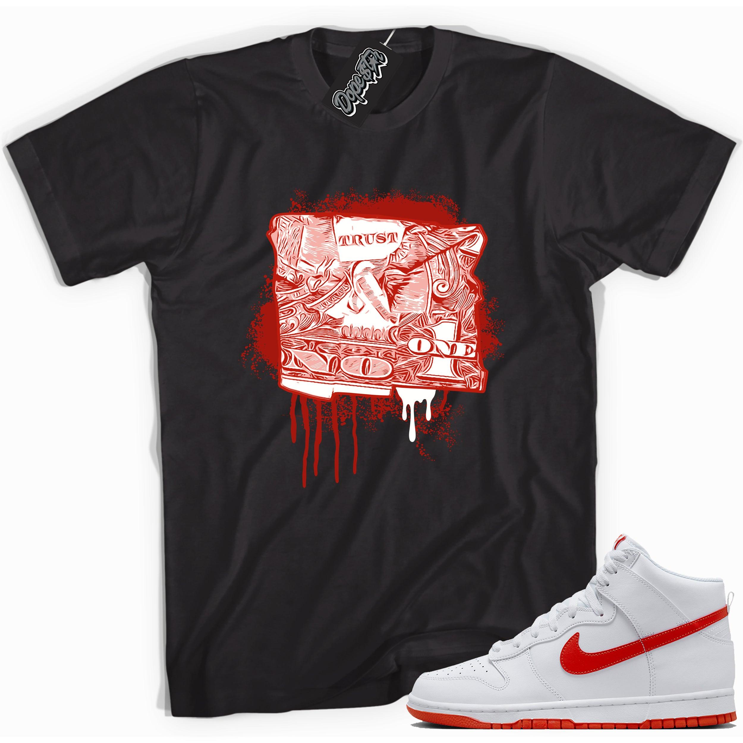 Cool black graphic tee with 'trust no one dollar bill' print, that perfectly matches Nike Dunk High White Picante Red sneakers.
