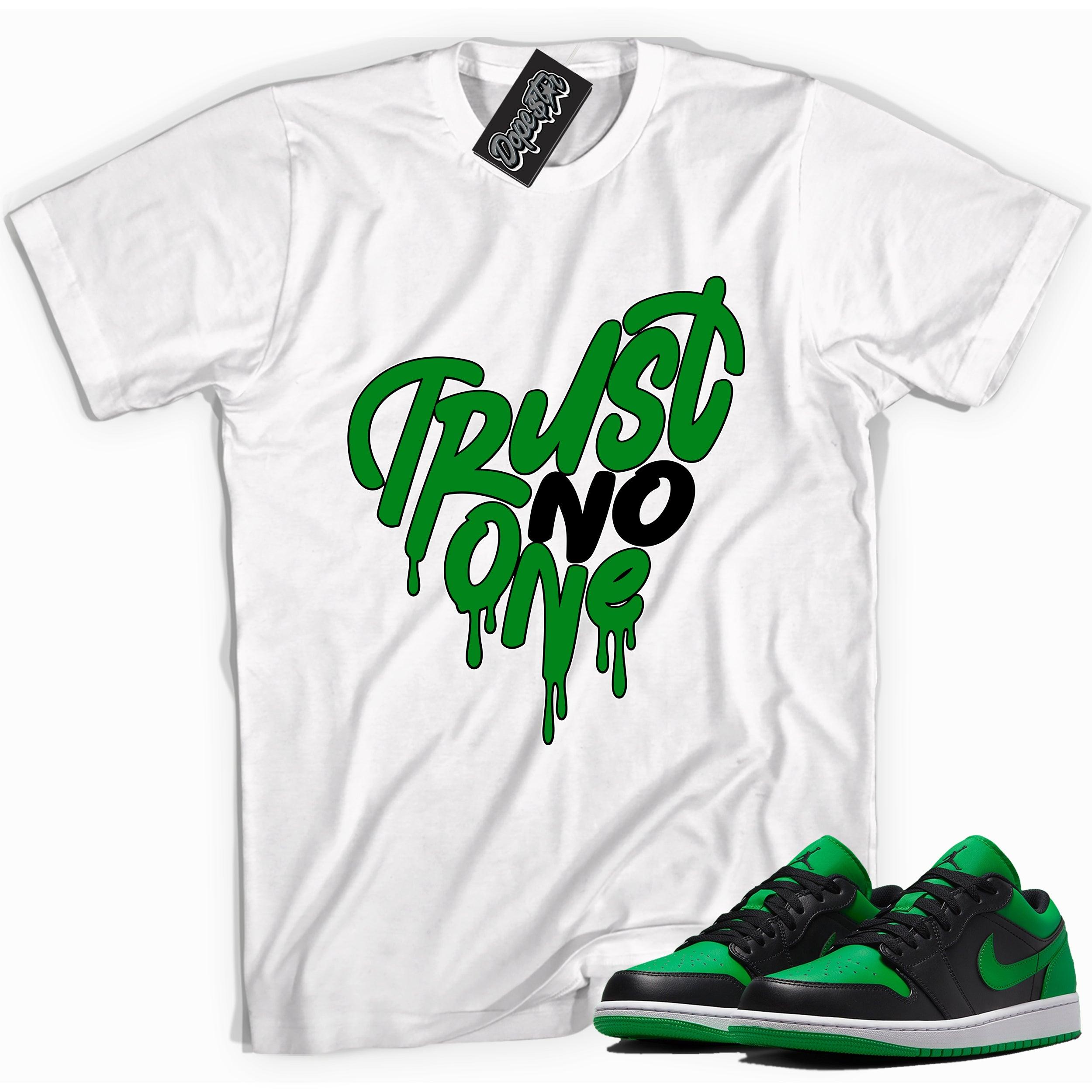 Cool white graphic tee with 'trust no one' print, that perfectly matches Air Jordan 1 Low Lucky Green sneakers