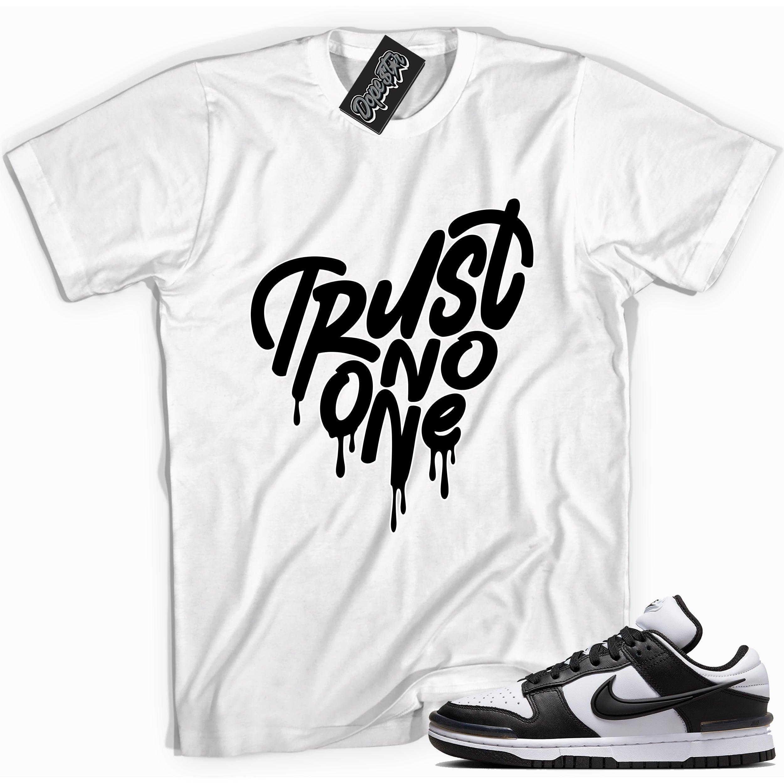 Cool white graphic tee with 'trust no one' print, that perfectly matches Nike Dunk Low Twist Panda sneakers.