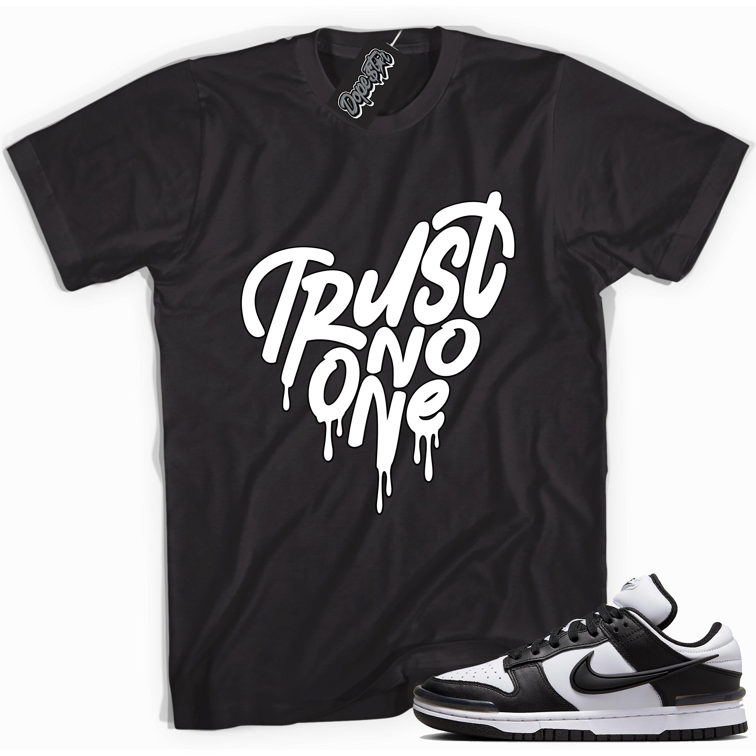 Cool black graphic tee with 'trust no one' print, that perfectly matches Nike Dunk Low Twist Panda sneakers.