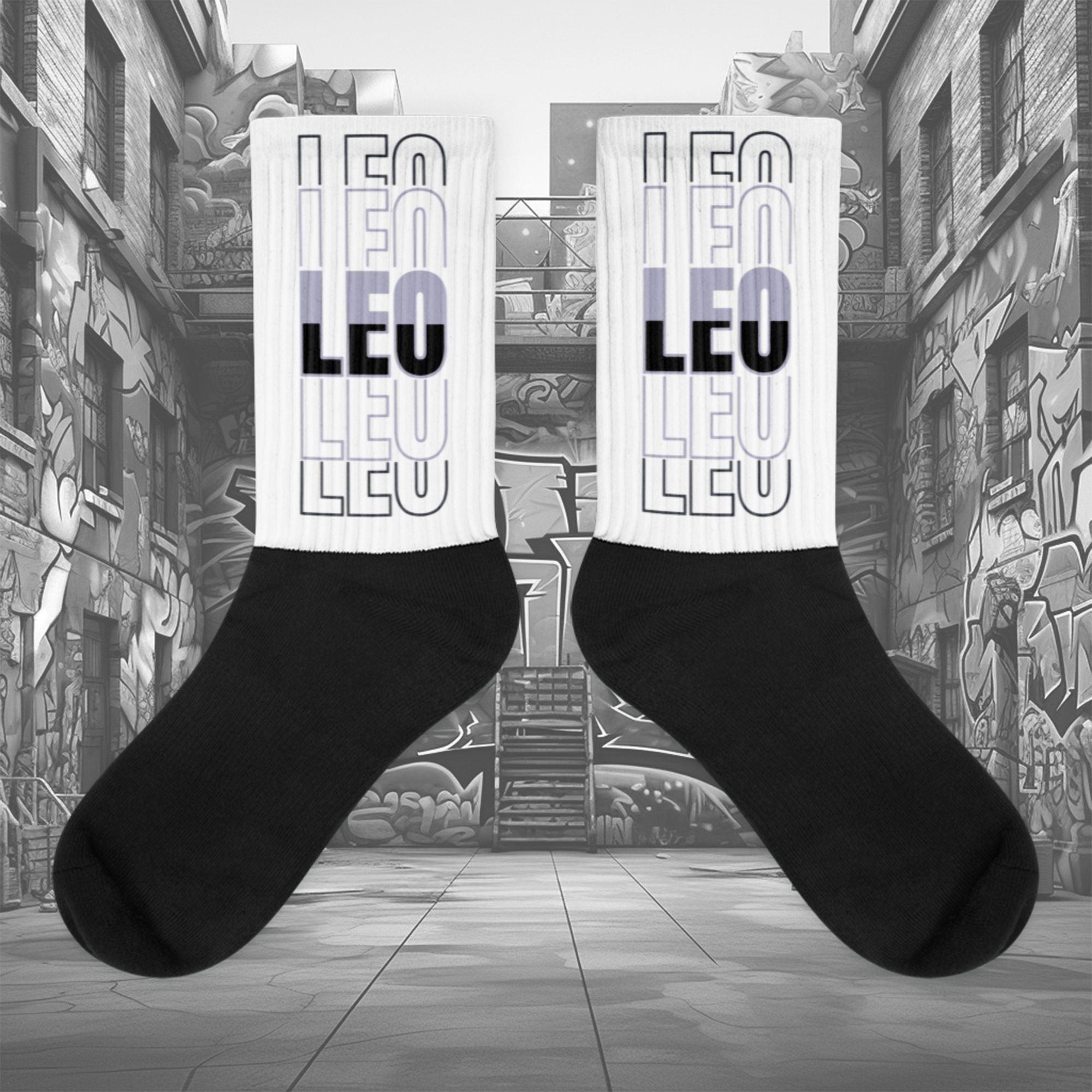  Showcases the view of the socks, highlighting the vibrant 'LEO' design, which perfectly complements the Air Jordan 8 Winterized  sneakers. The intricate pattern and color scheme inspired by the  theme are prominently displayed.  Focusing on the ribbed leg , cusioned bottoms and the snug fit of the socks. This angle provides a clear view of the texture and quality of the material blend.