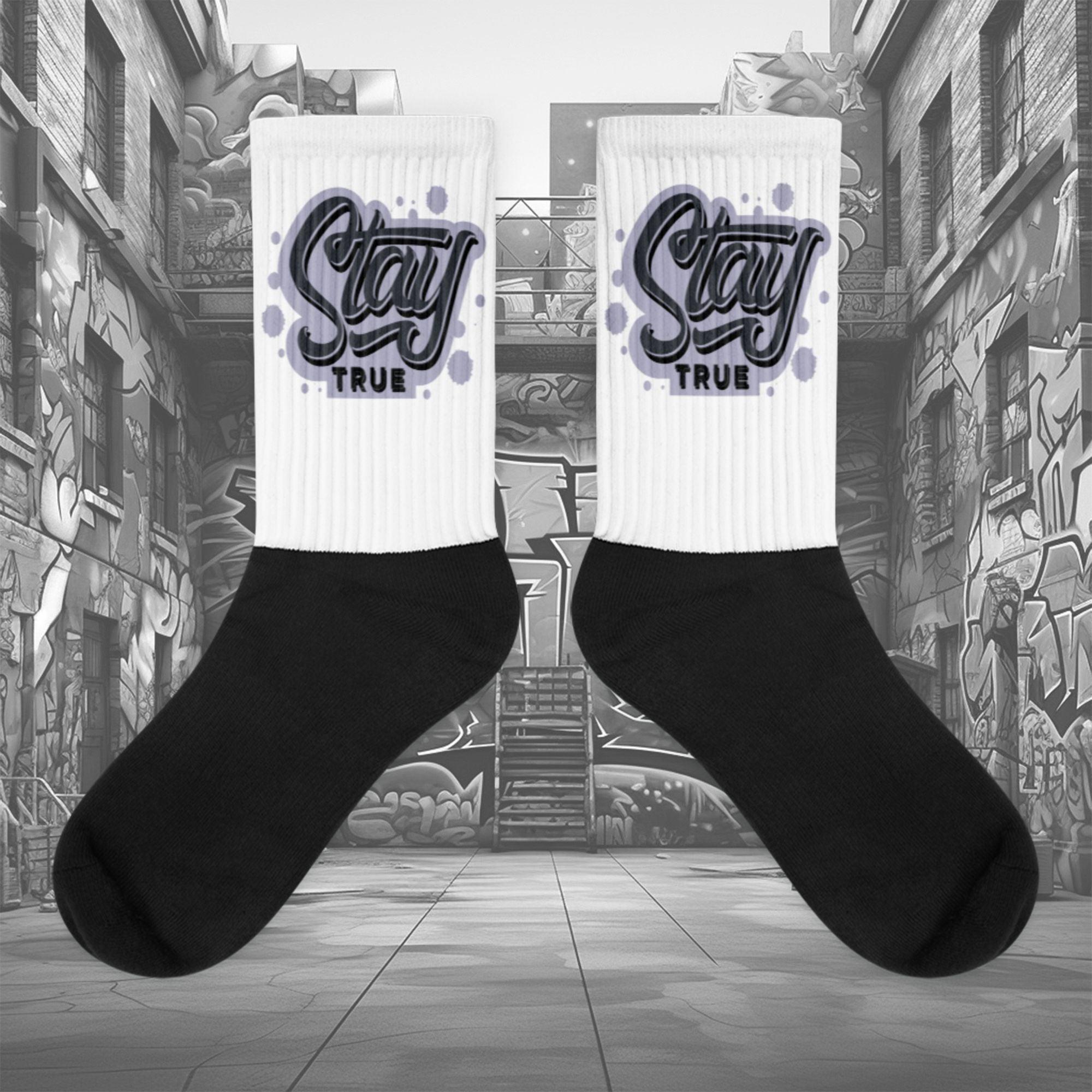  Showcases the view of the socks, highlighting the vibrant 'Stay True' design, which perfectly complements the Air Jordan 8 Winterized  sneakers. The intricate pattern and color scheme inspired by the  theme are prominently displayed.  Focusing on the ribbed leg , cusioned bottoms and the snug fit of the socks. This angle provides a clear view of the texture and quality of the material blend.