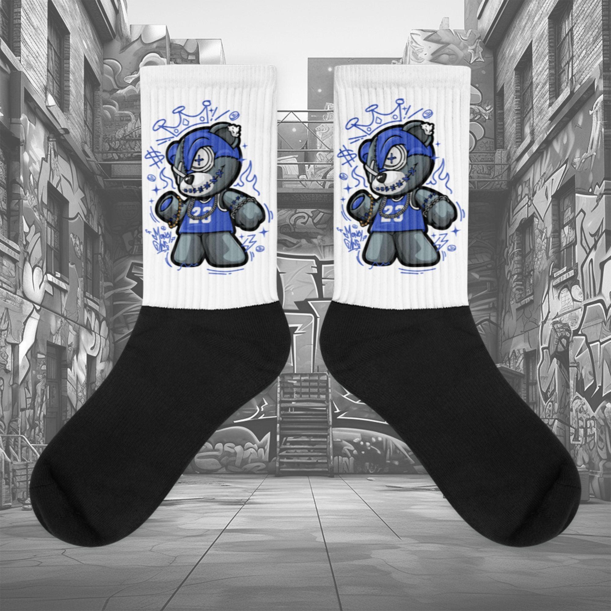 Showcases the view of the socks, highlighting the vibrant ' MEDUSA ' design, which perfectly complements the Nike Dunk Disrupt 2 Hyper Royal sneakers. The intricate pattern and color scheme inspired by the  theme are prominently displayed.  Focusing on the ribbed leg , cusioned bottoms and the snug fit of the socks. This angle provides a clear view of the texture and quality of the material blend.