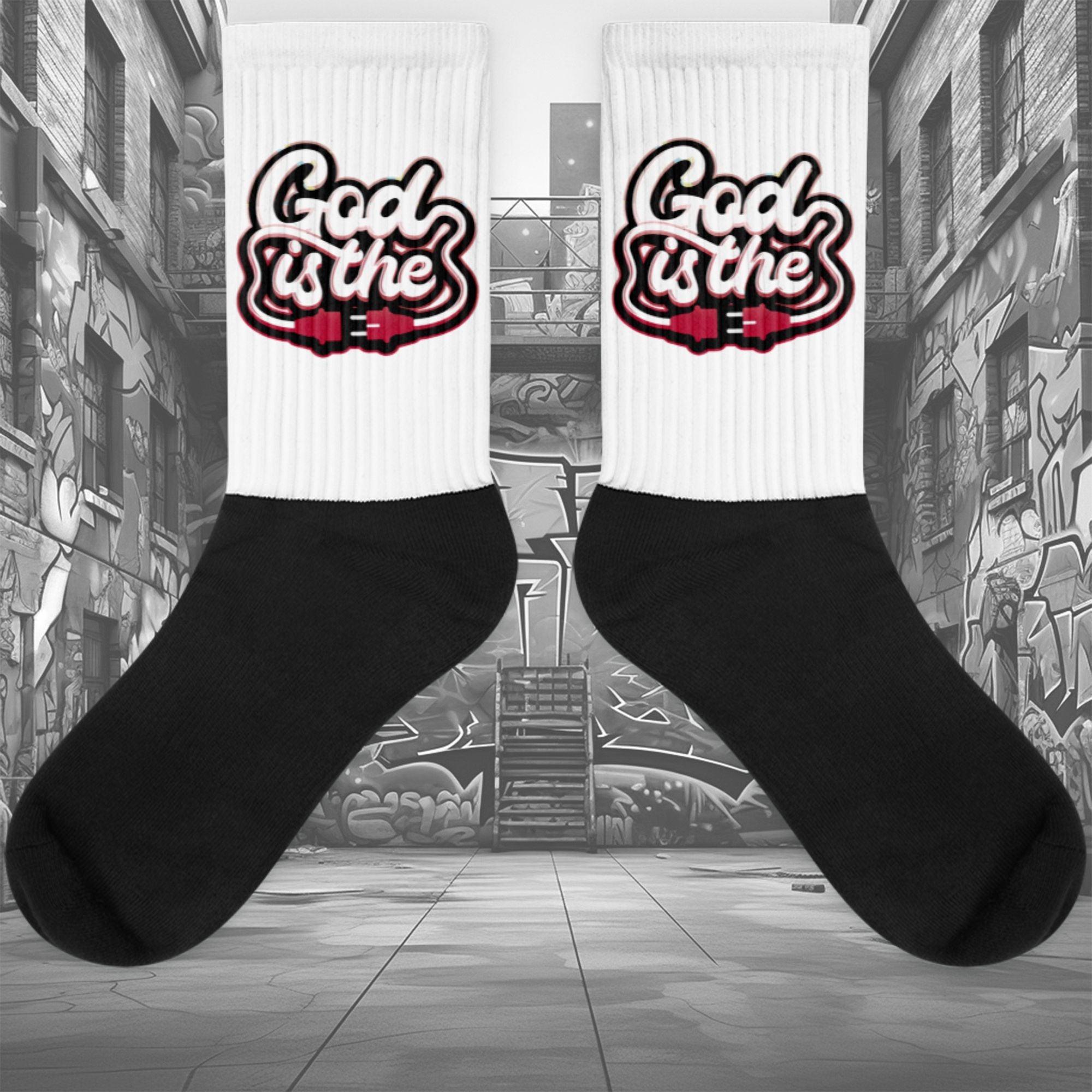 Showcases the view of the socks, highlighting the vibrant ‘ God Is The Plug ’ design, which perfectly complements the Air Jordan 1 Retro High OG Next Chapter Spider-Verse sneakers. The intricate pattern and color scheme inspired by the Spider-Verse theme are prominently displayed.  Focusing on the ribbed leg , cusioned bottoms and the snug fit of the socks. This angle provides a clear view of the texture and quality of the material blend