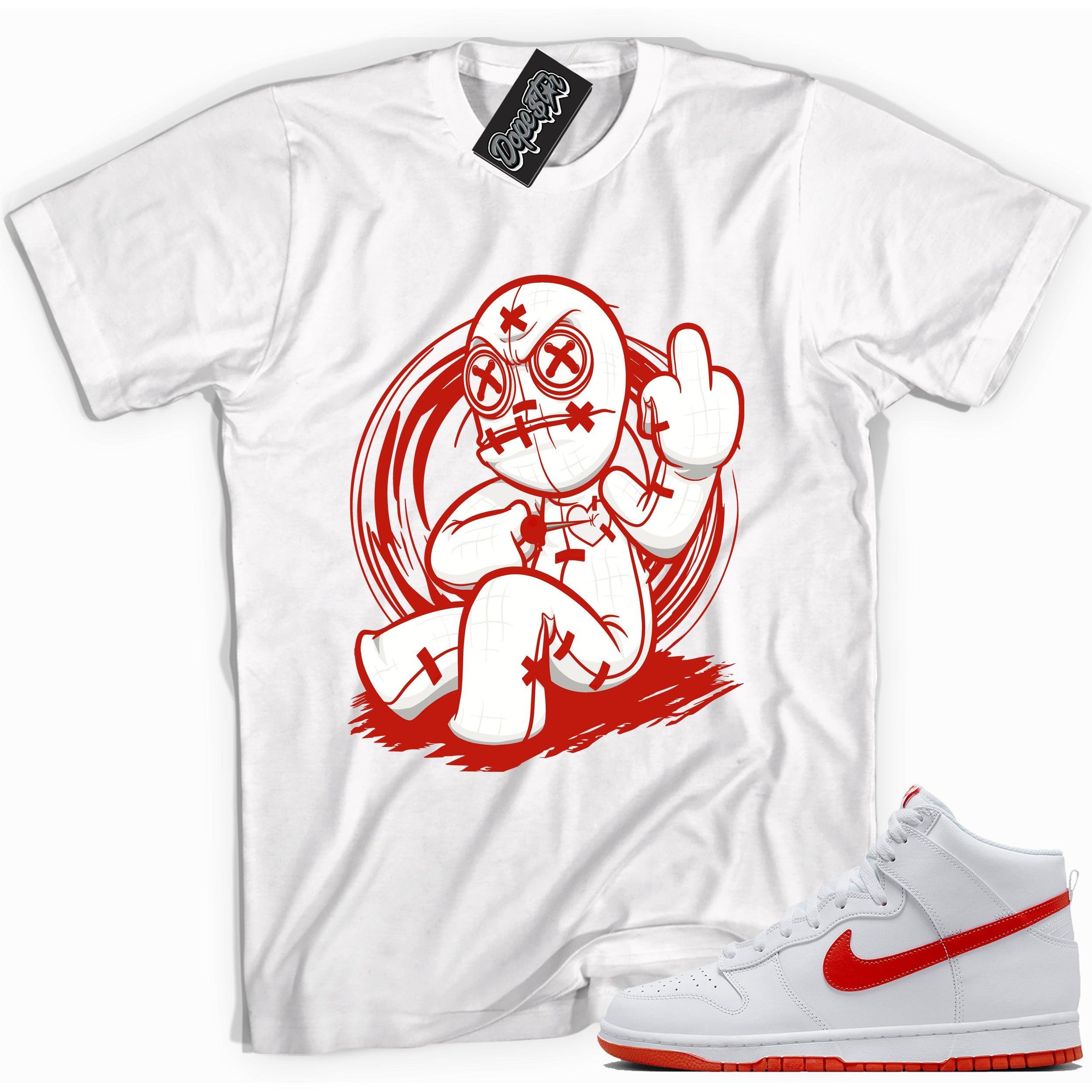 Cool white graphic tee with 'voodoo doll' print, that perfectly matches Nike Dunk High White Picante Red sneakers.