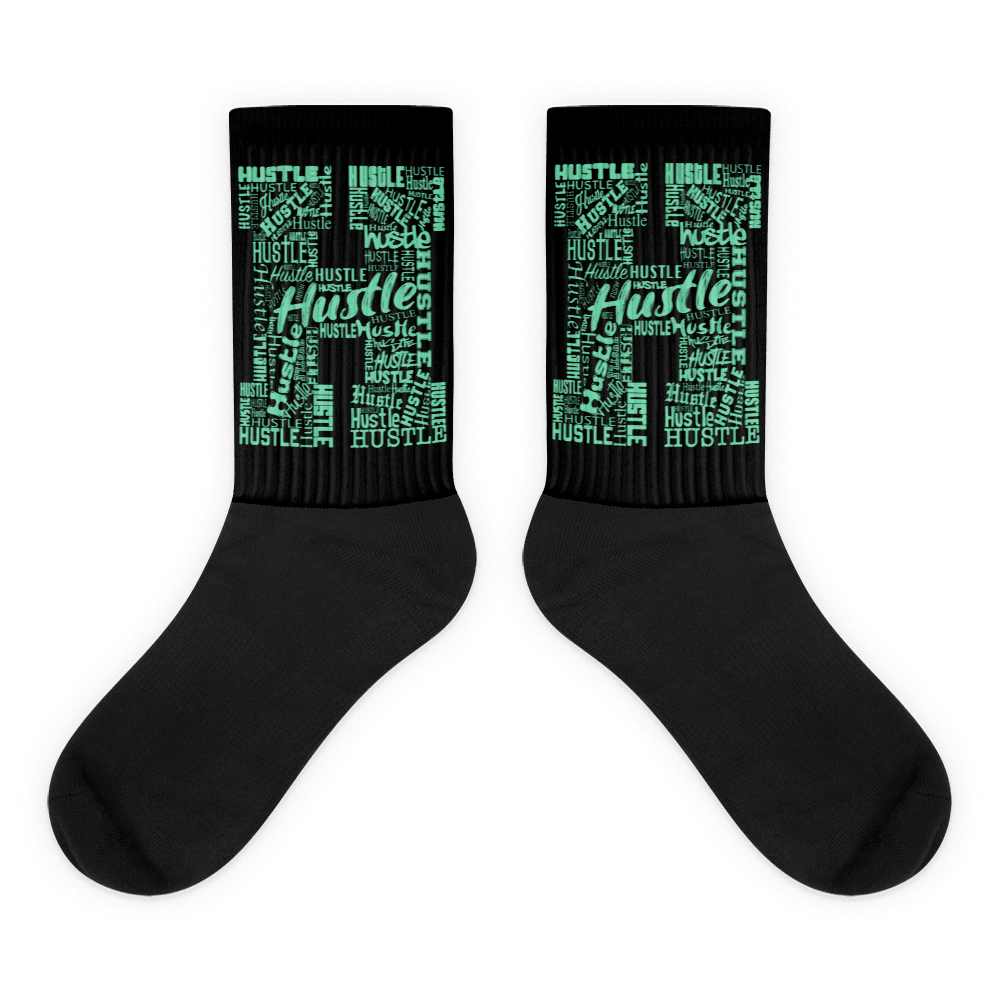  Showcases the view of the socks, highlighting the vibrant ' Hustle ' design, which perfectly complements the Nike Dunk Green Glow sneakers. The intricate pattern and color scheme inspired by the  theme are prominently displayed.  Focusing on the ribbed leg , cusioned bottoms and the snug fit of the socks. This angle provides a clear view of the texture and quality of the material blend.