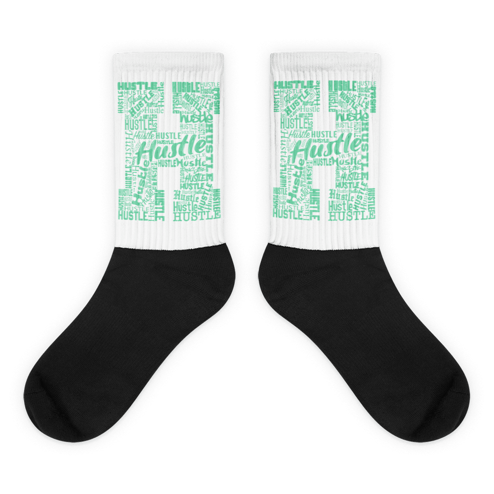  Showcases the view of the socks, highlighting the vibrant ' Hustle ' design, which perfectly complements the Nike Dunk Green Glow sneakers. The intricate pattern and color scheme inspired by the  theme are prominently displayed.  Focusing on the ribbed leg , cusioned bottoms and the snug fit of the socks. This angle provides a clear view of the texture and quality of the material blend.