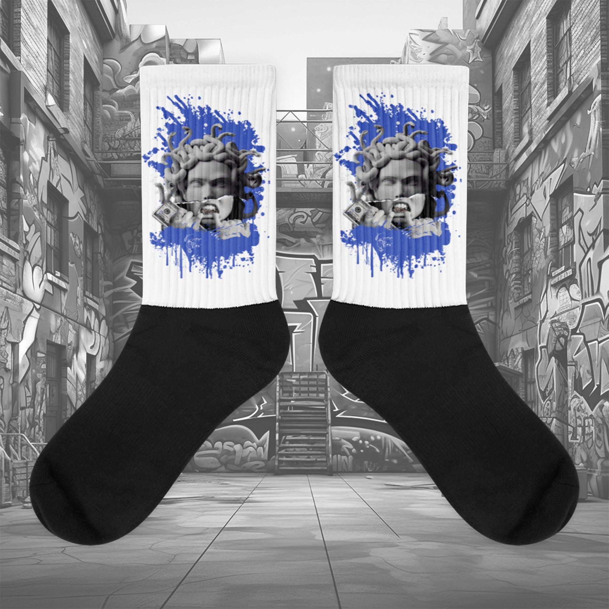 Showcases the view of the socks, highlighting the vibrant ' MEDUSA ' design, which perfectly complements the Nike Dunk Disrupt 2 Hyper Royal sneakers. The intricate pattern and color scheme inspired by the  theme are prominently displayed.  Focusing on the ribbed leg , cusioned bottoms and the snug fit of the socks. This angle provides a clear view of the texture and quality of the material blend.