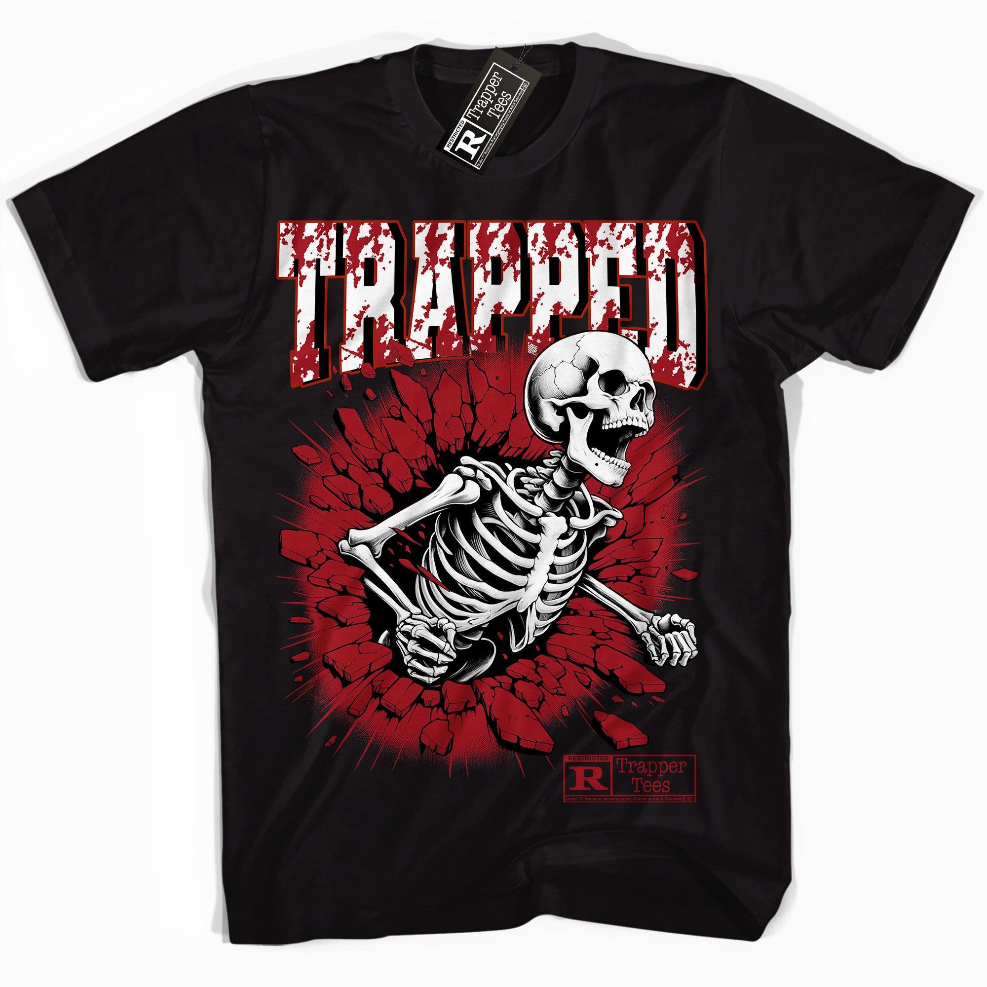 Cool Black graphic tee with “ Trapped Skull ” print, that perfectly matches Air Jordan 12 Cherry sneakers 