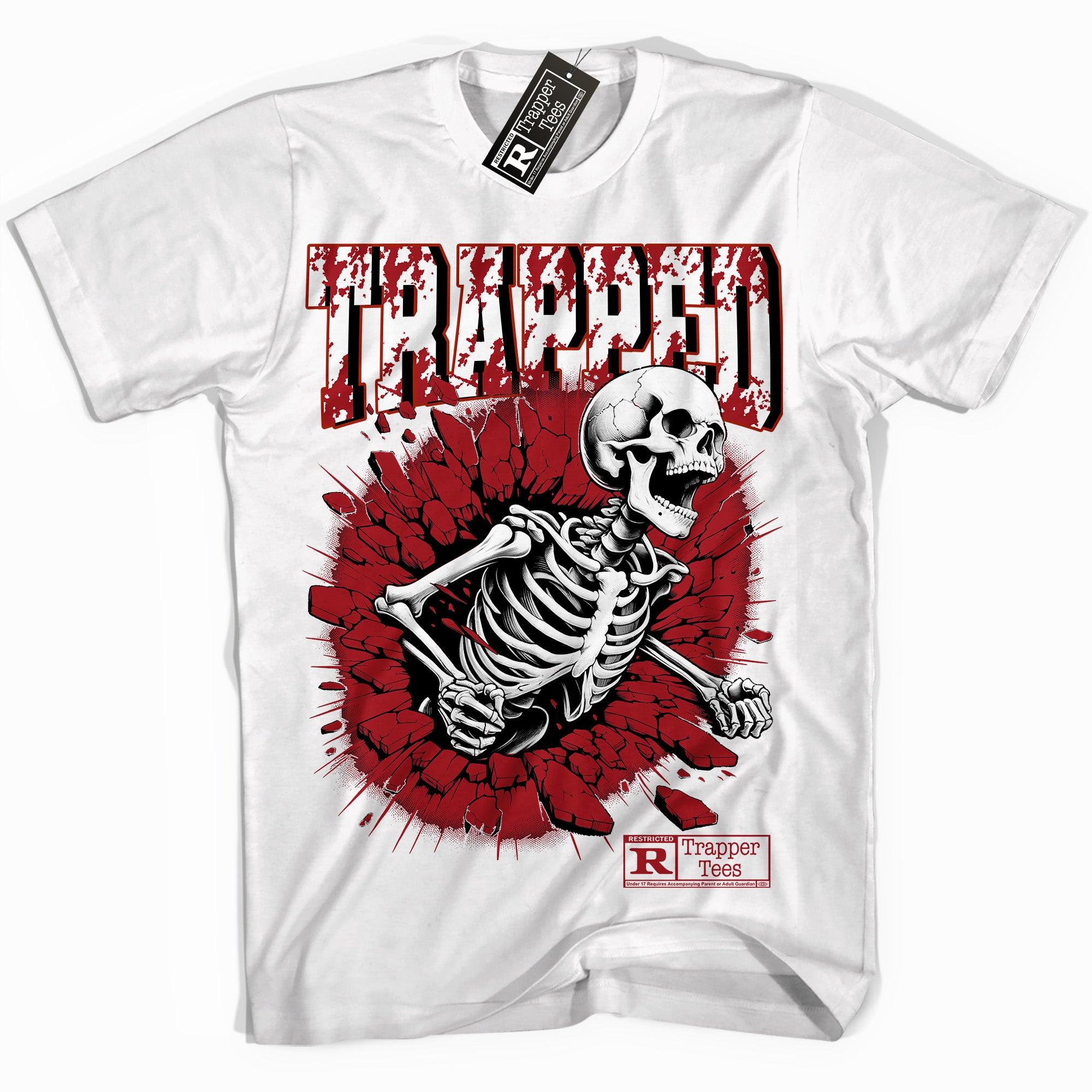 Cool White graphic tee with “ Trapped Skull ” print, that perfectly matches Air Jordan 12 Cherry sneakers 