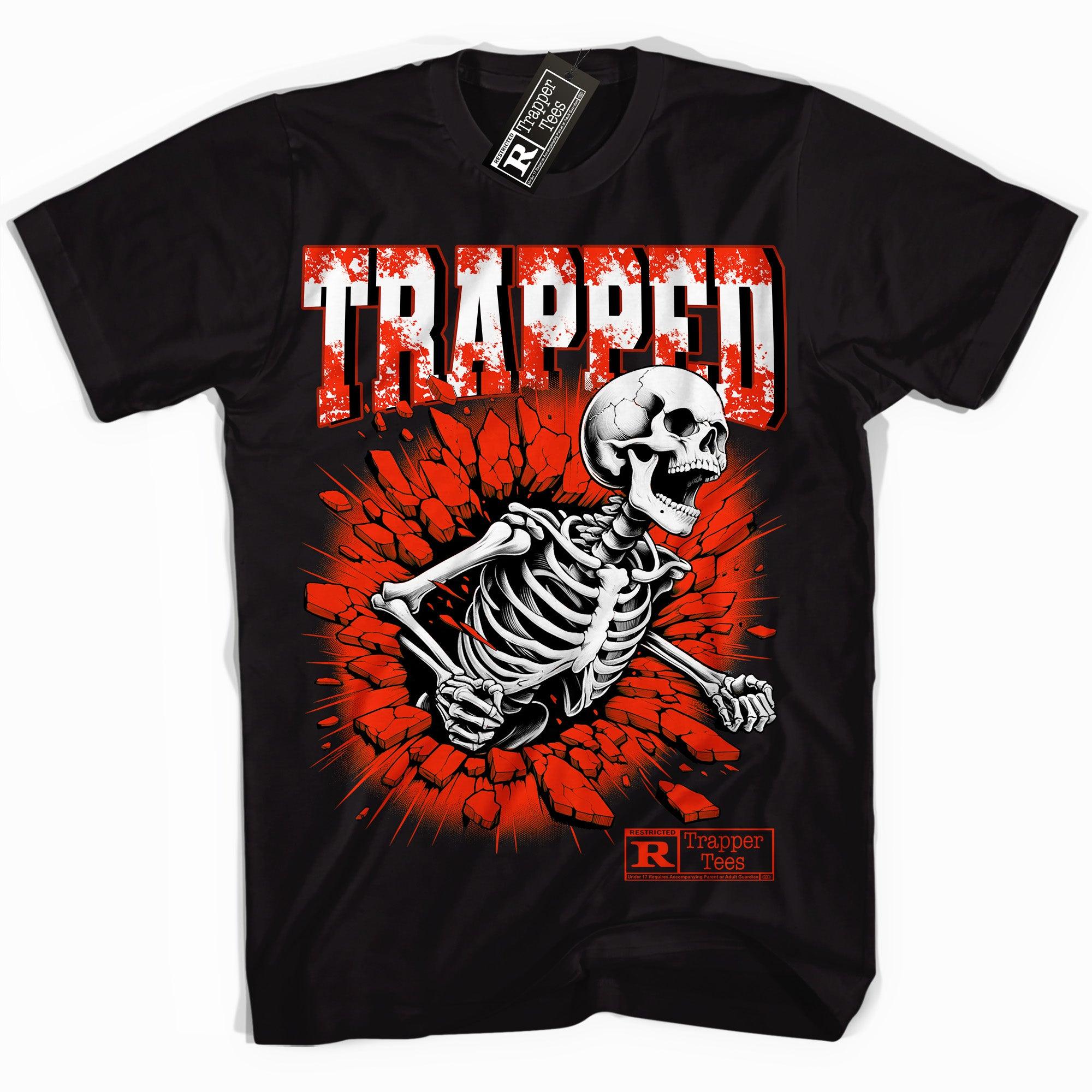 Cool Black graphic tee with “ Trapped Skull ” print, that perfectly matches Air Jordan 11 Cherry sneakers 