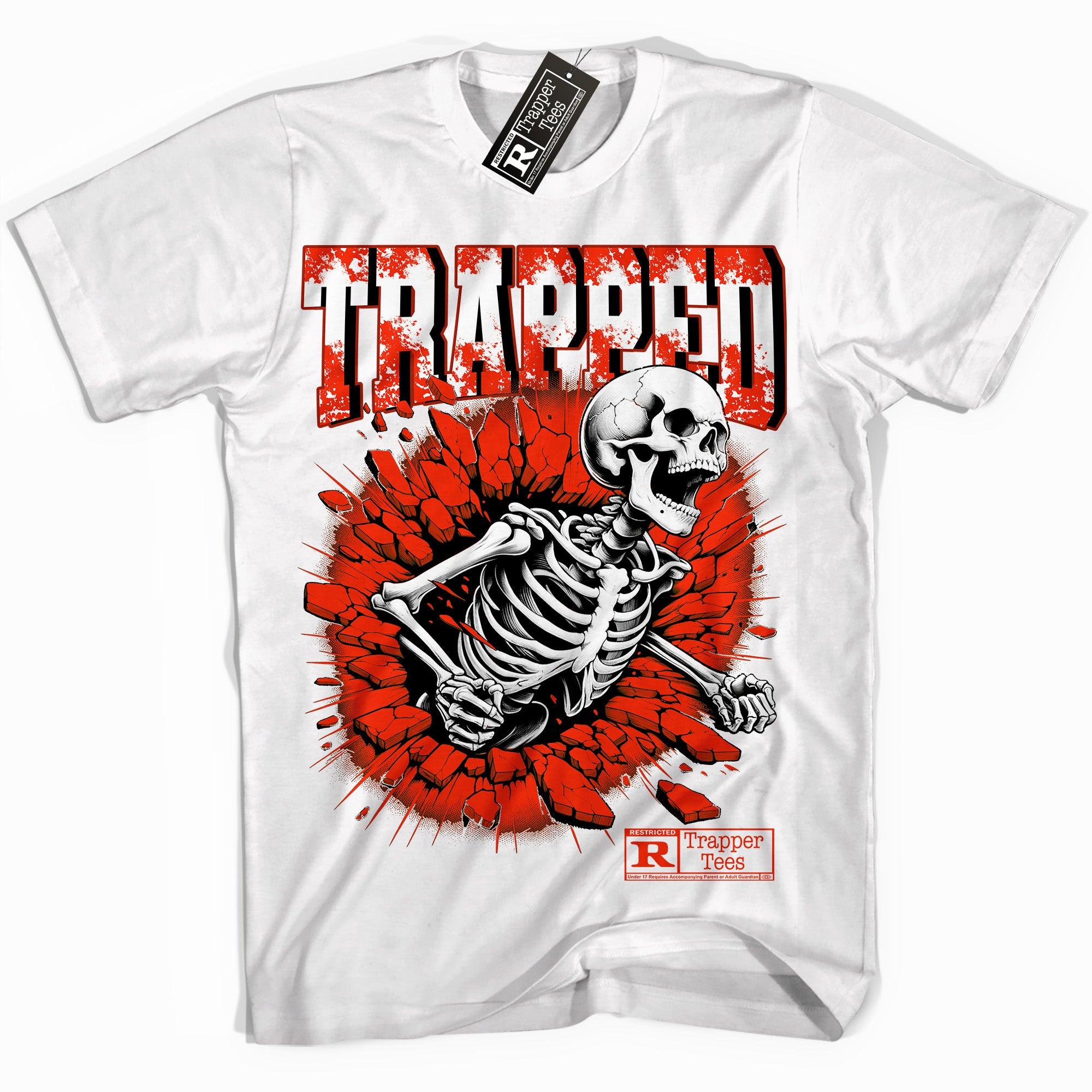 Cool White graphic tee with “ Trapped Skull ” print, that perfectly matches Air Jordan 11 Cherry sneakers 